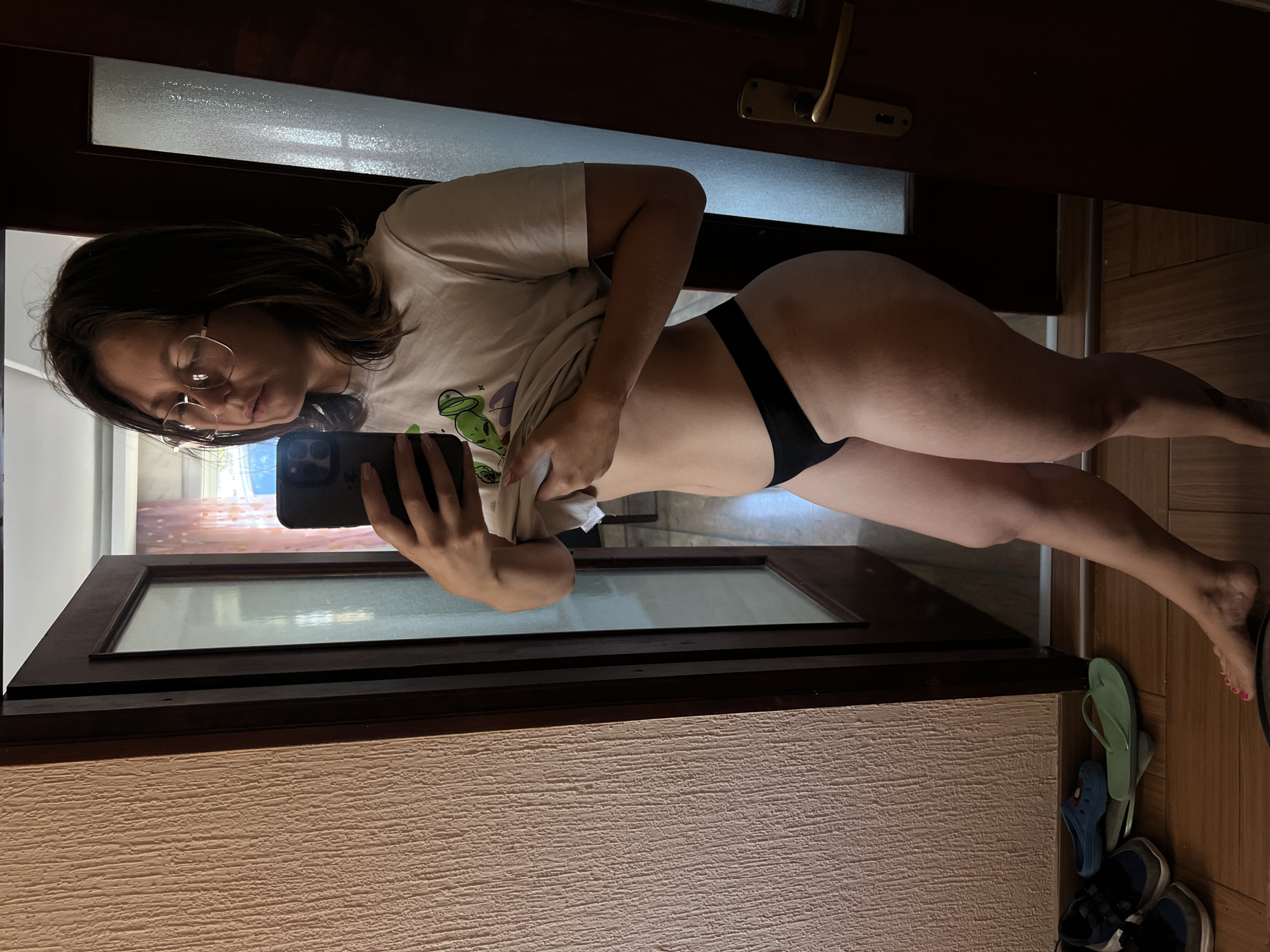 Woman takes mirror selfie in Podgorica apartment