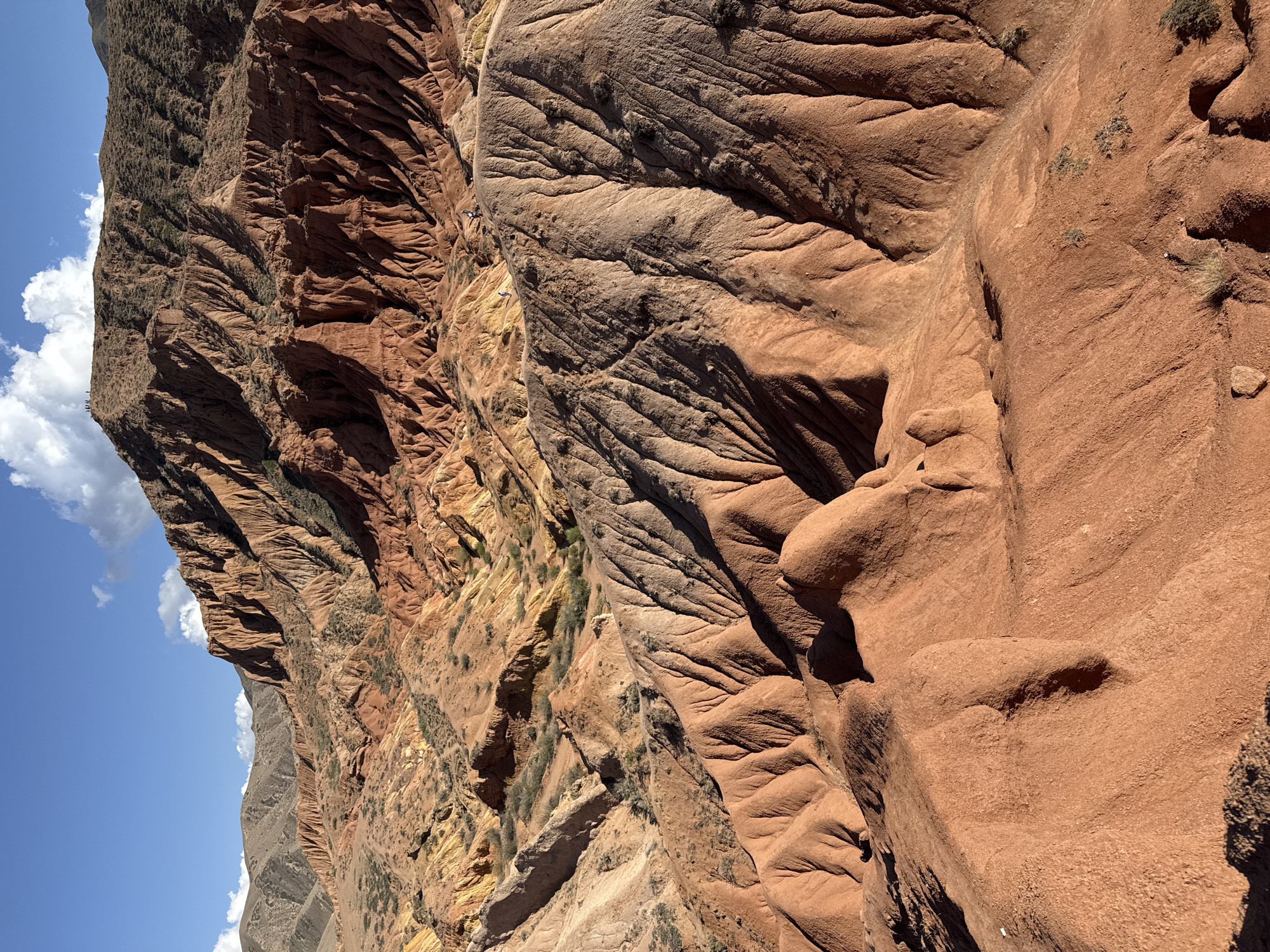 Hikers traverse rugged canyon near Tosor, Kyrgyzstan