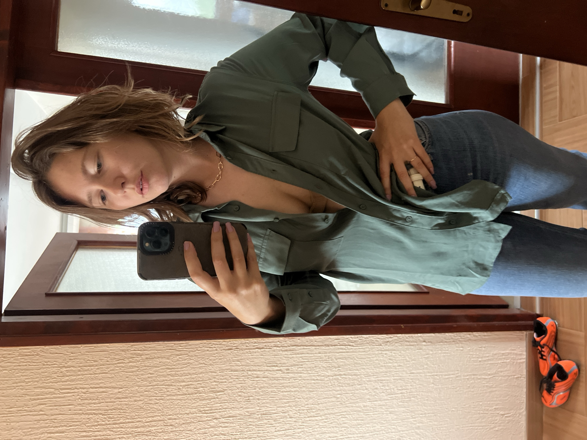 Woman takes mirror selfie in Podgorica apartment