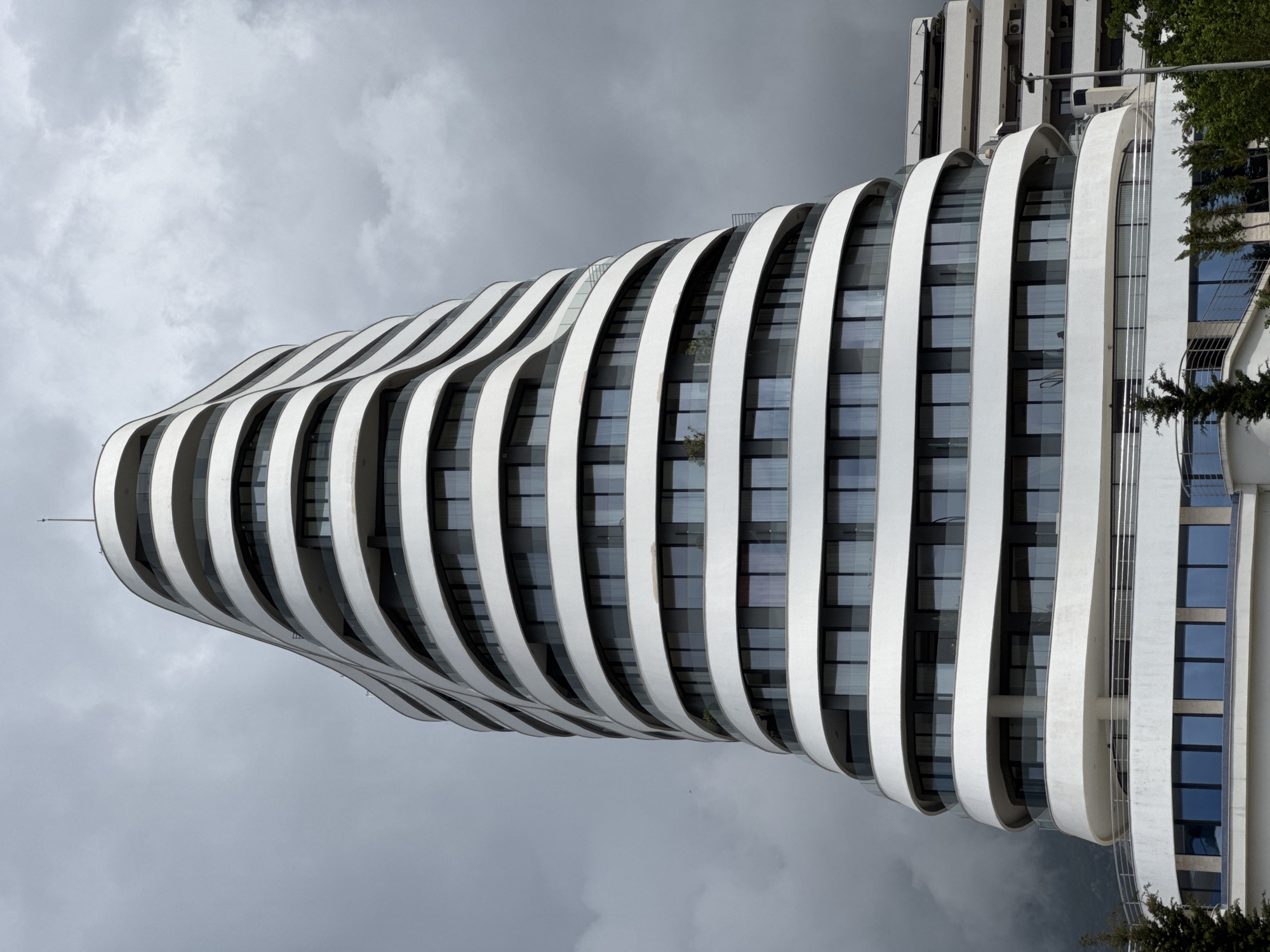 Modern curved high-rise photographed in Boreti, Montenegro
