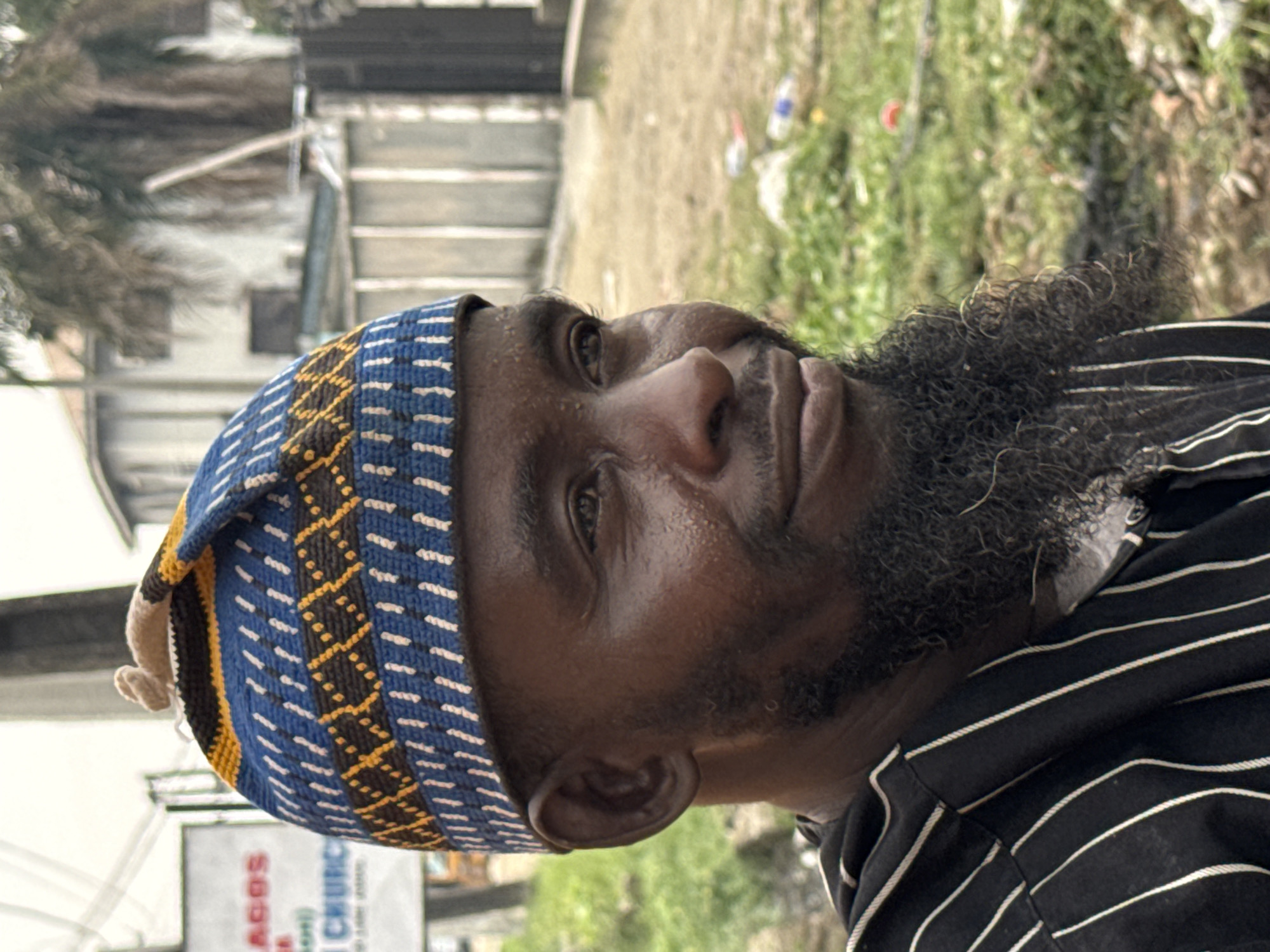 Man in traditional kufi hat photographed in Ado, Nigeria