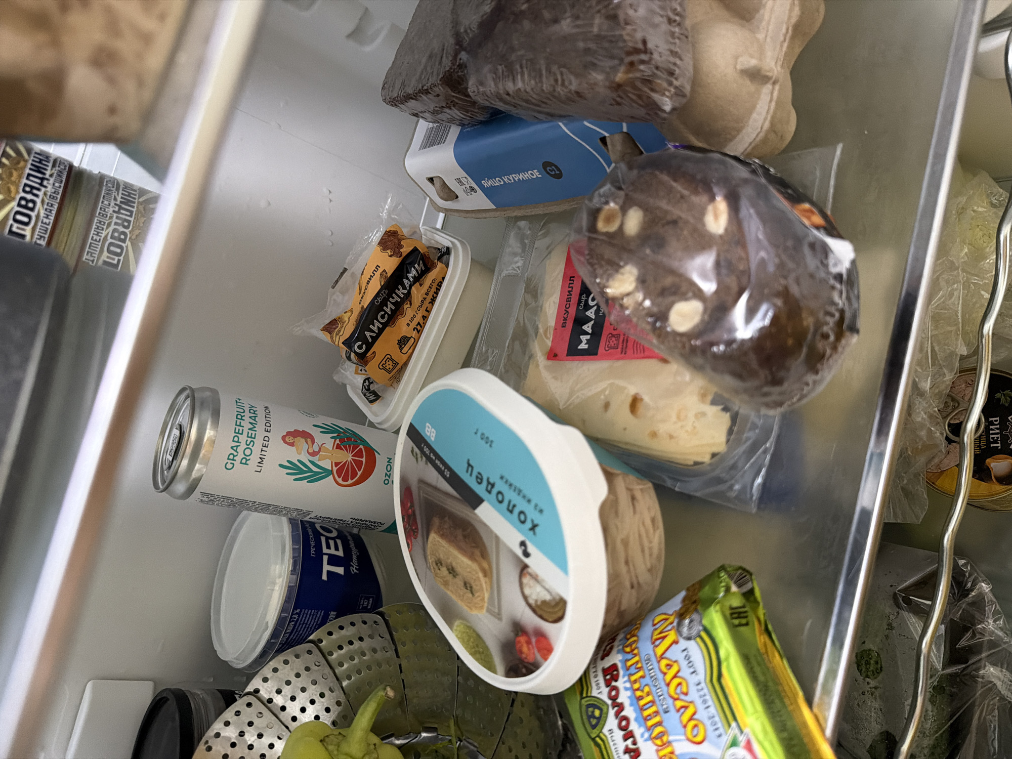 Fridge contents and a green '#oink' graphic, Moscow