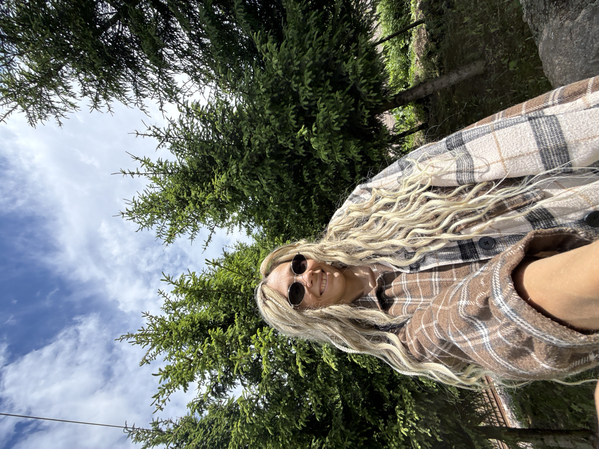 Woman takes selfie with child in Russian woods