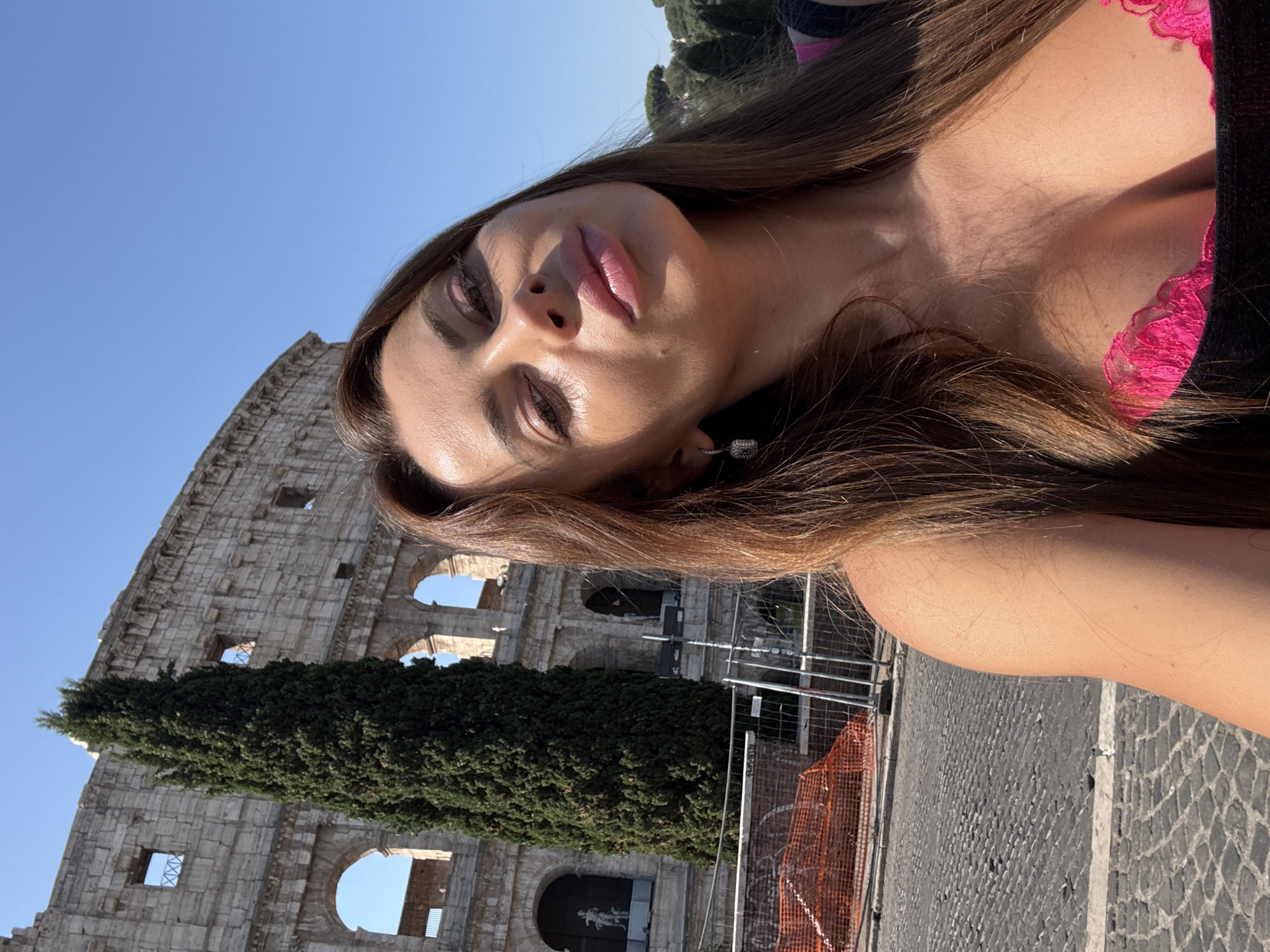 Selfie session at the Colosseum on a clear Rome morning