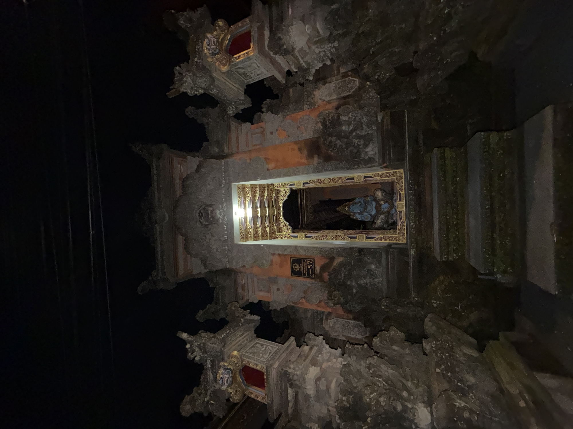 Balinese temple gateway documented at night in Ubud