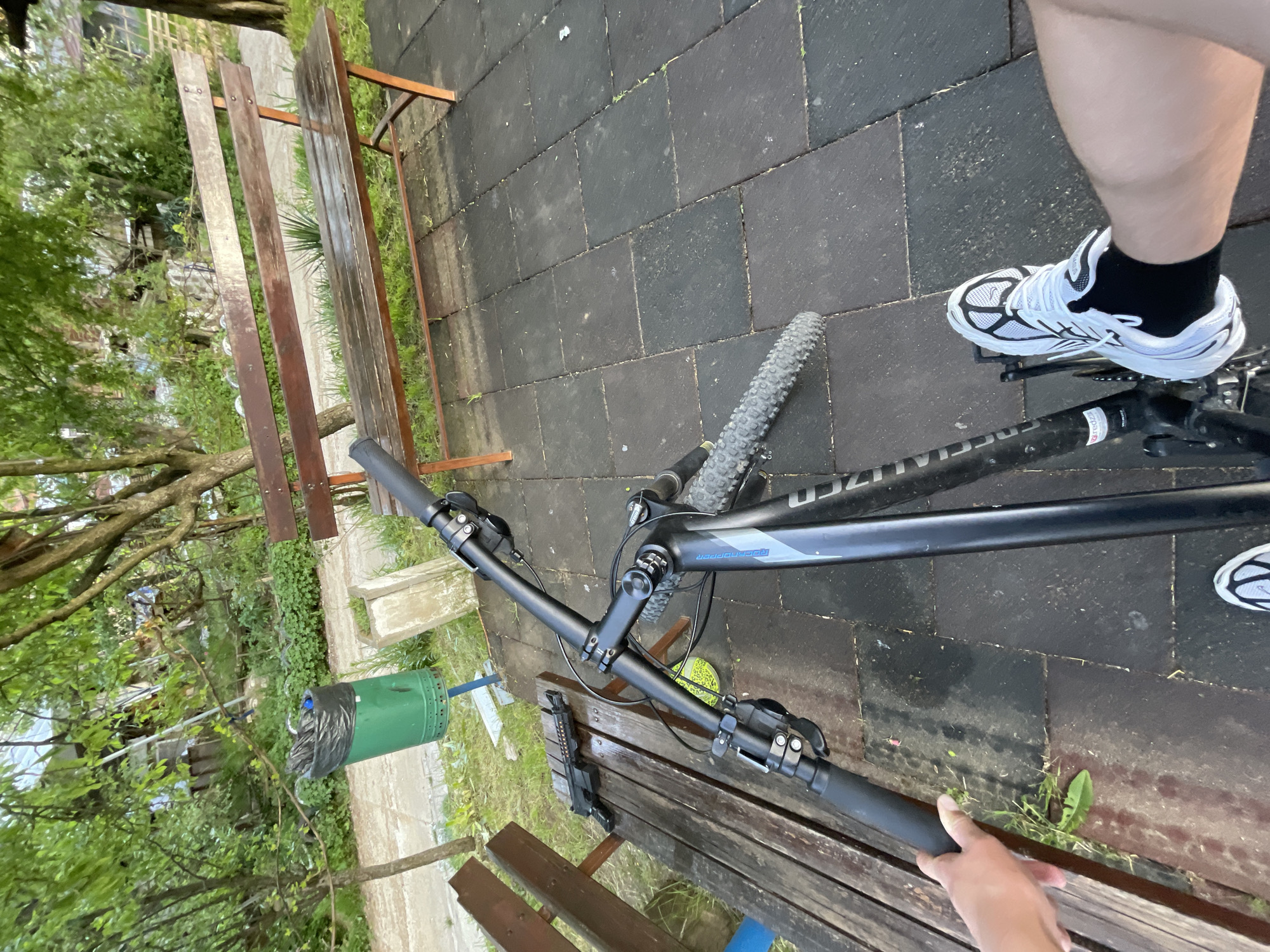 Person cycles, plays with dog, handles pellet gun at Bulgarian playground