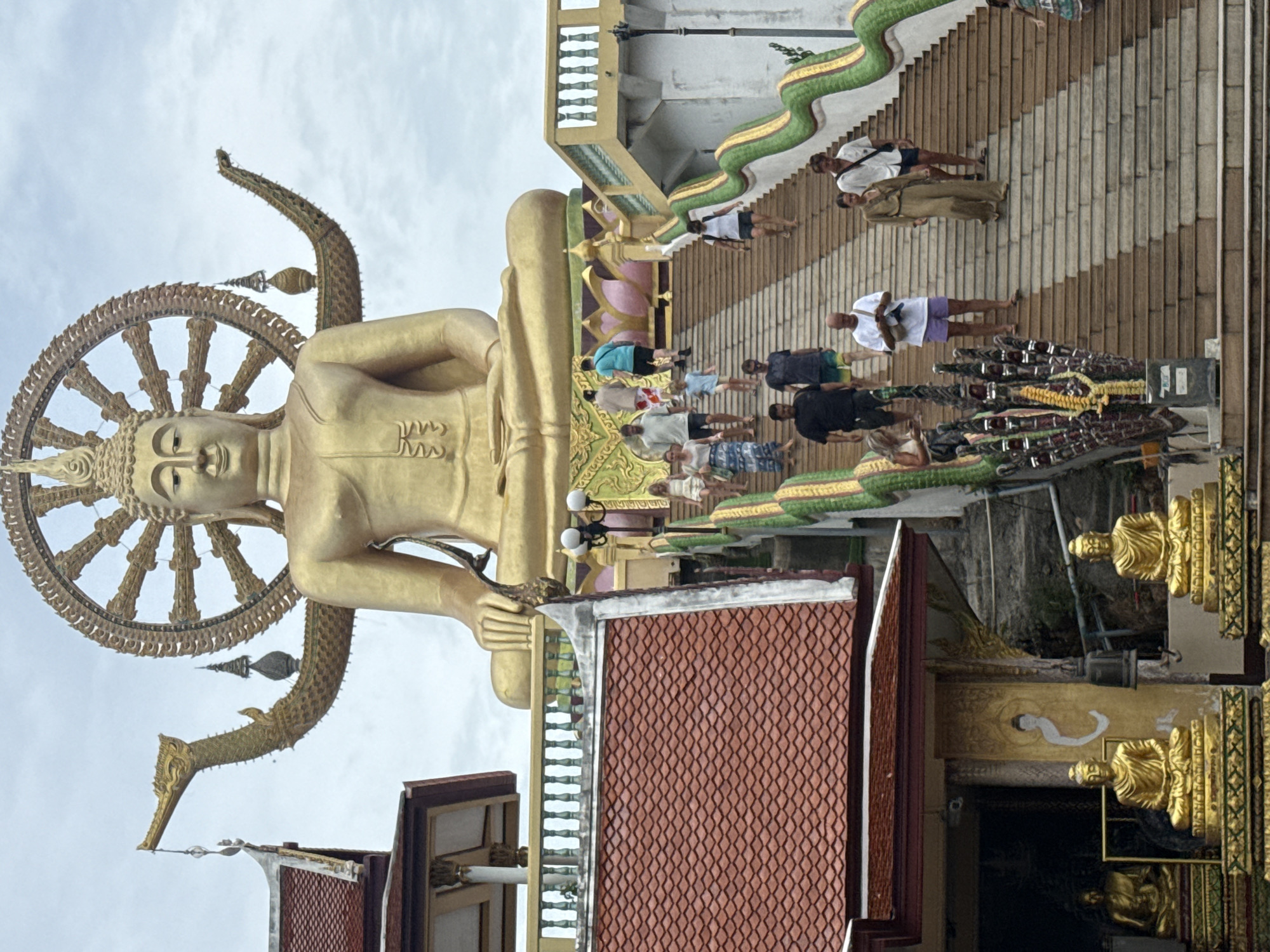 Golden Buddha statue atop a wide staircase, Ko Samui