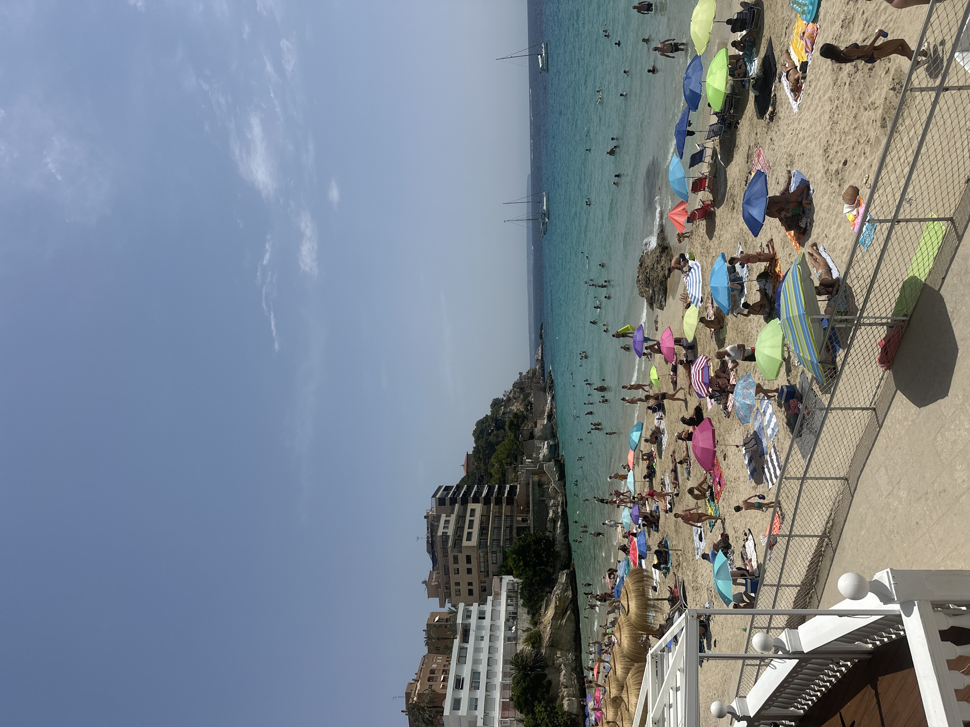 Crowded beaches and clear water along Mallorca's Sant Agustí coast