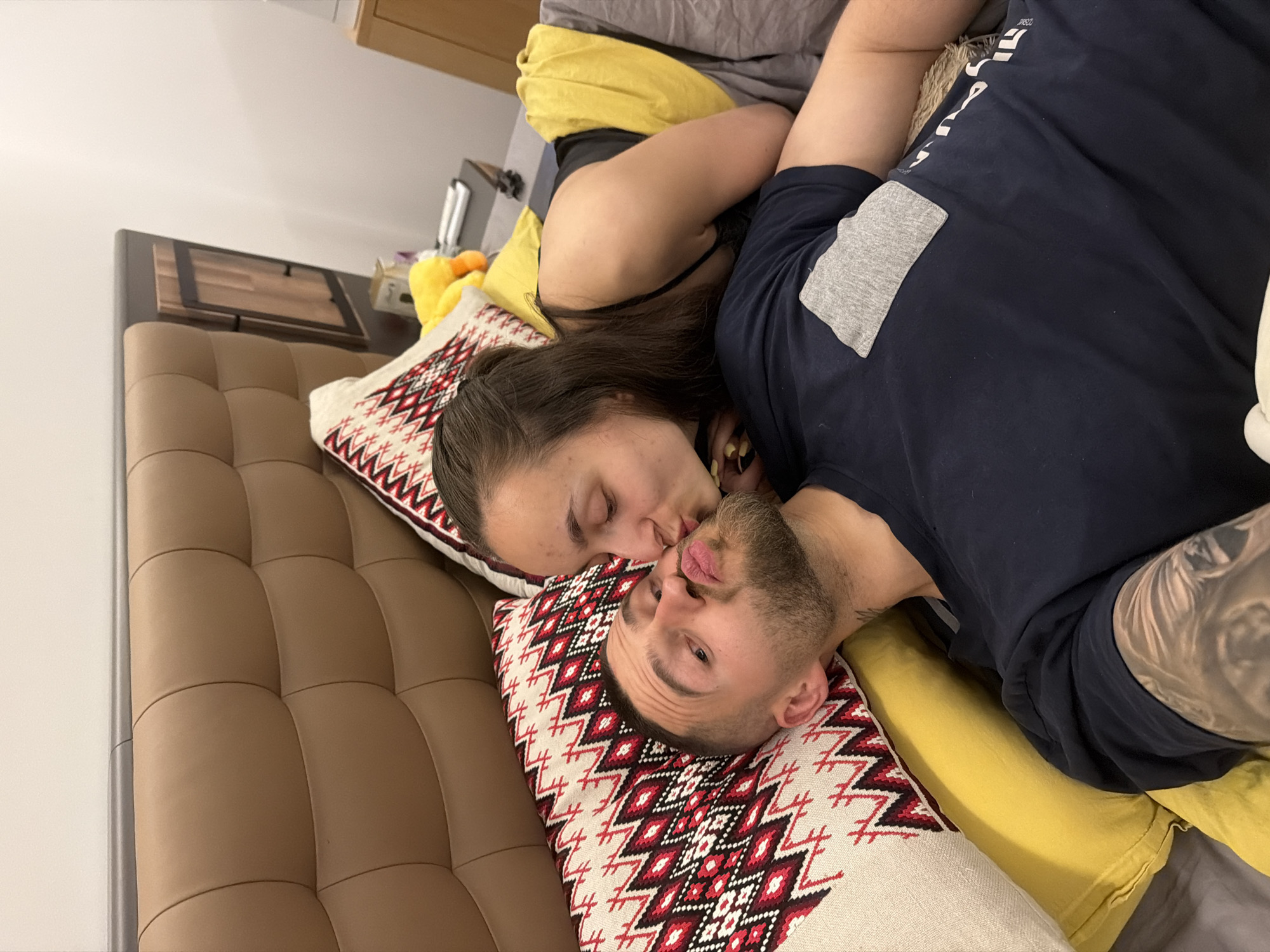 Intimate moment captured between couple in Sofia bedroom