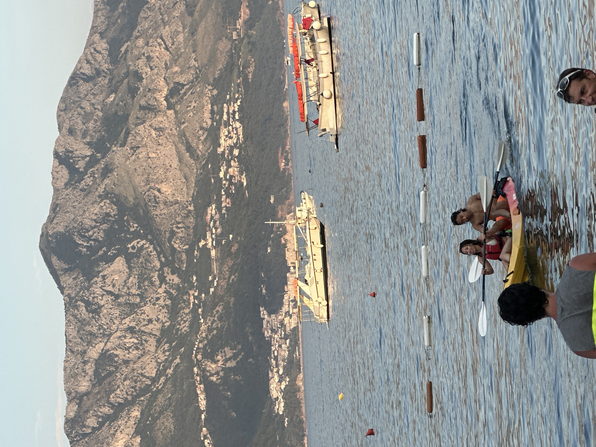 Budva in full summer swing — beach, boats, and boardwalk