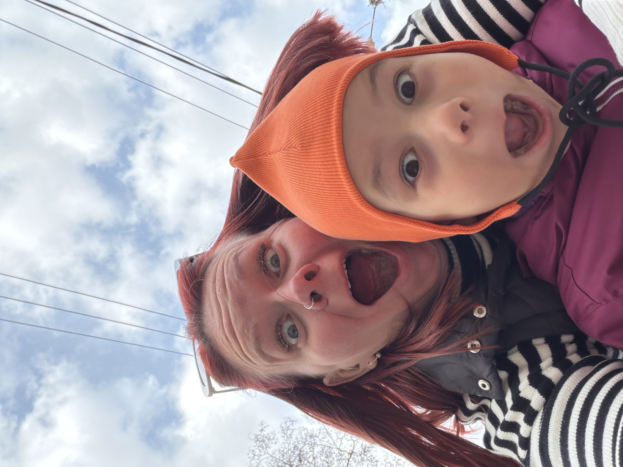 Adult and child share playful selfie moment in Chaikovsky