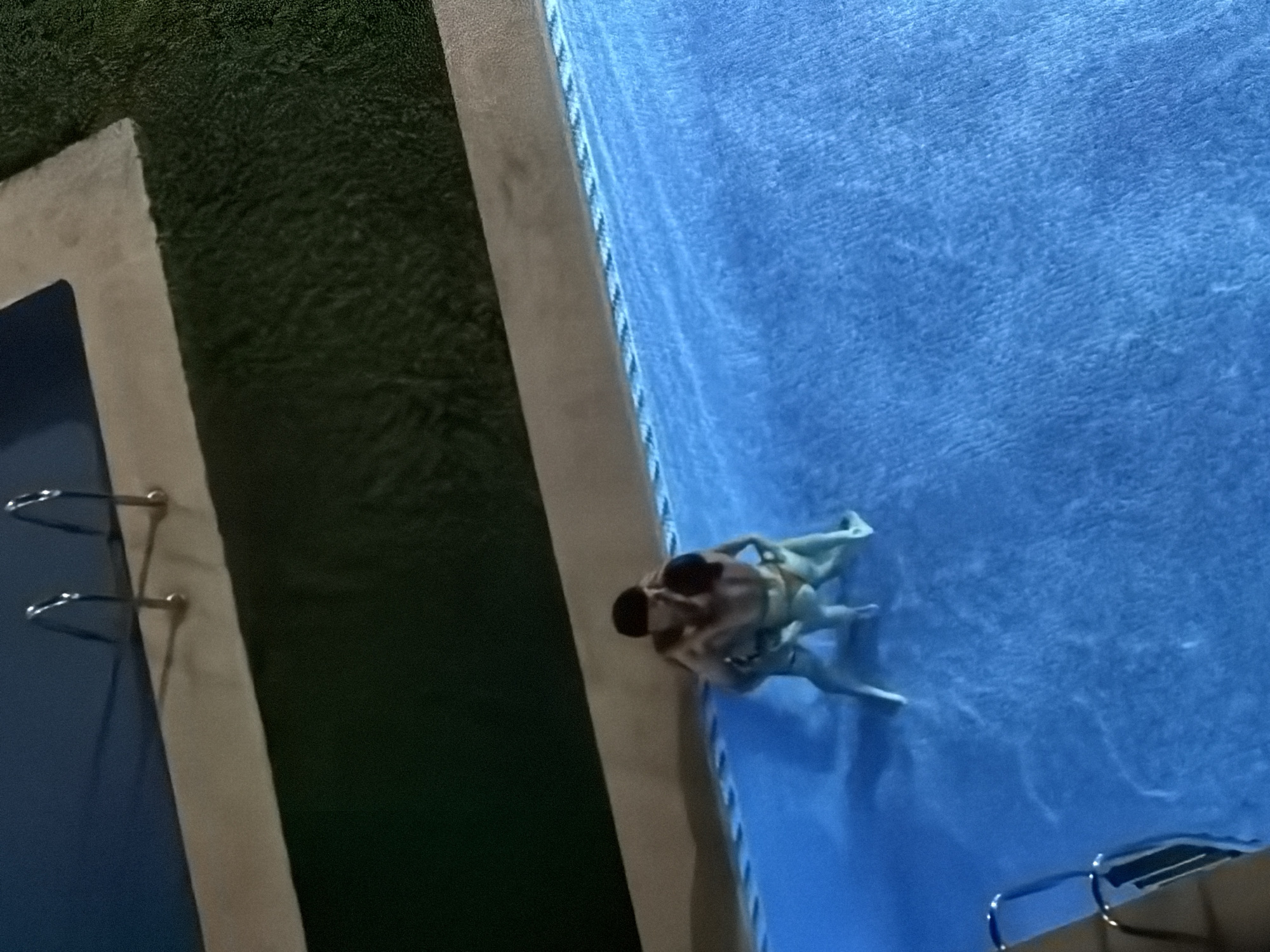Late-night pool session, aerial and ground views