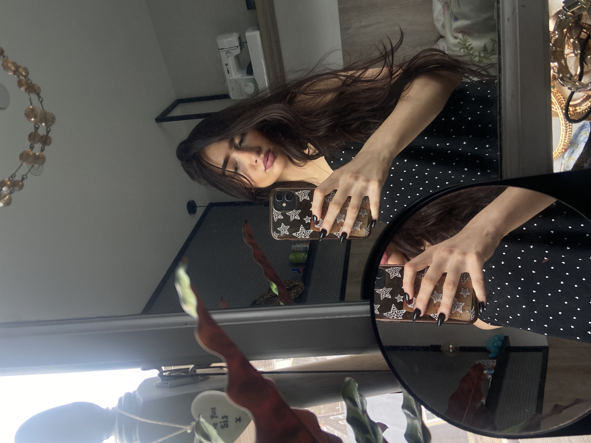 Young woman takes morning mirror selfies in London residence