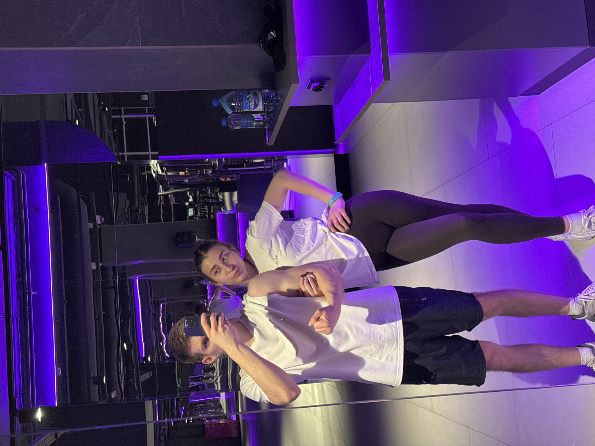 Couple documents workout session at Krasnoyarsk gym with selfies