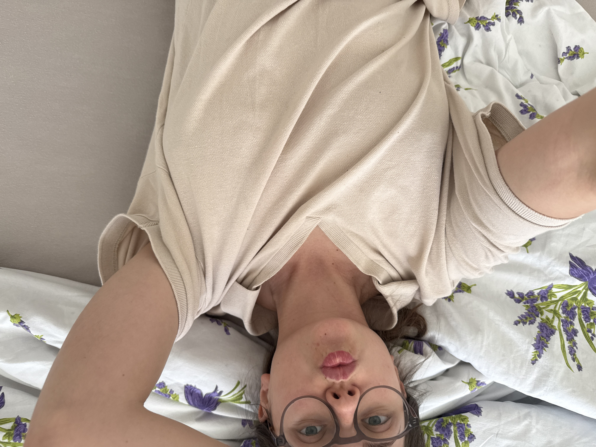 Woman takes multiple selfies in bed in Kőröshegy, Hungary