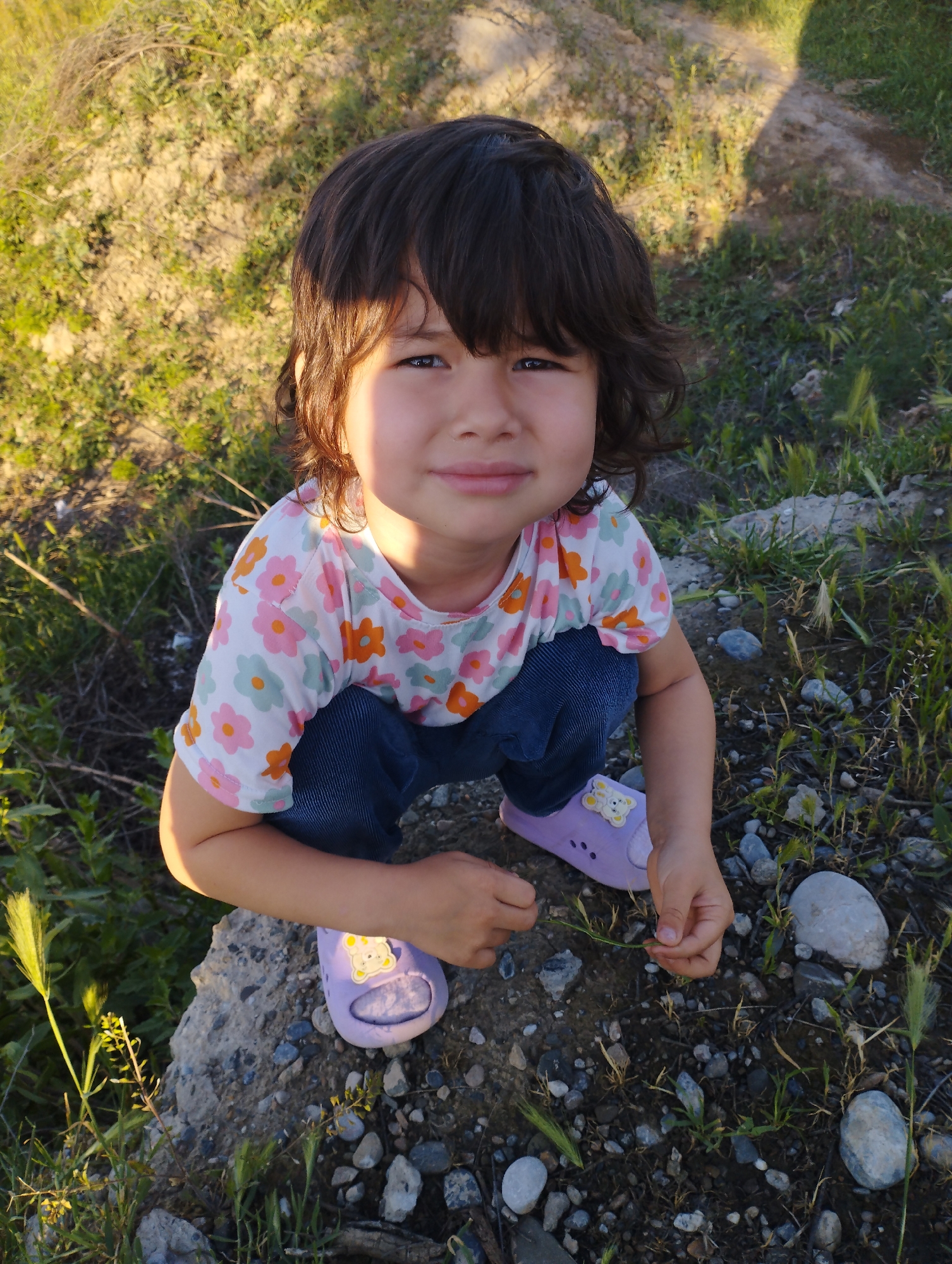 Girl documented in outdoor, indoor scenes in Mingchinar, Uzbekistan