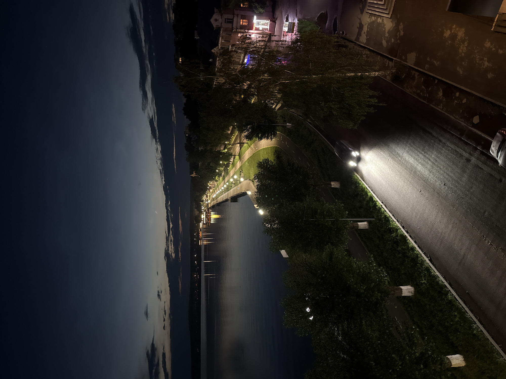 Votkinsk embankment at night, reservoir reflecting city lights