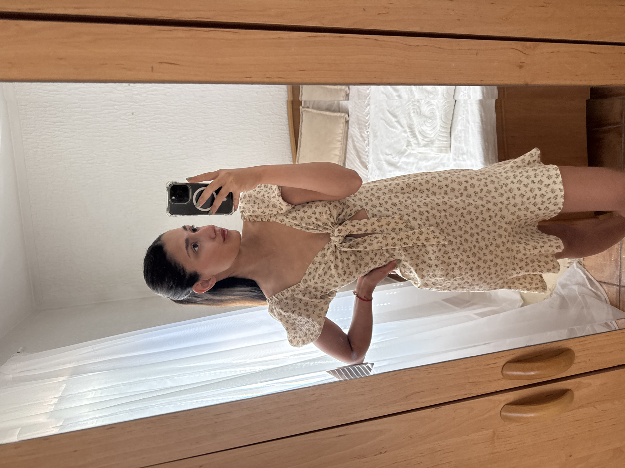 Woman takes selfies in floral dress in Montenegro village