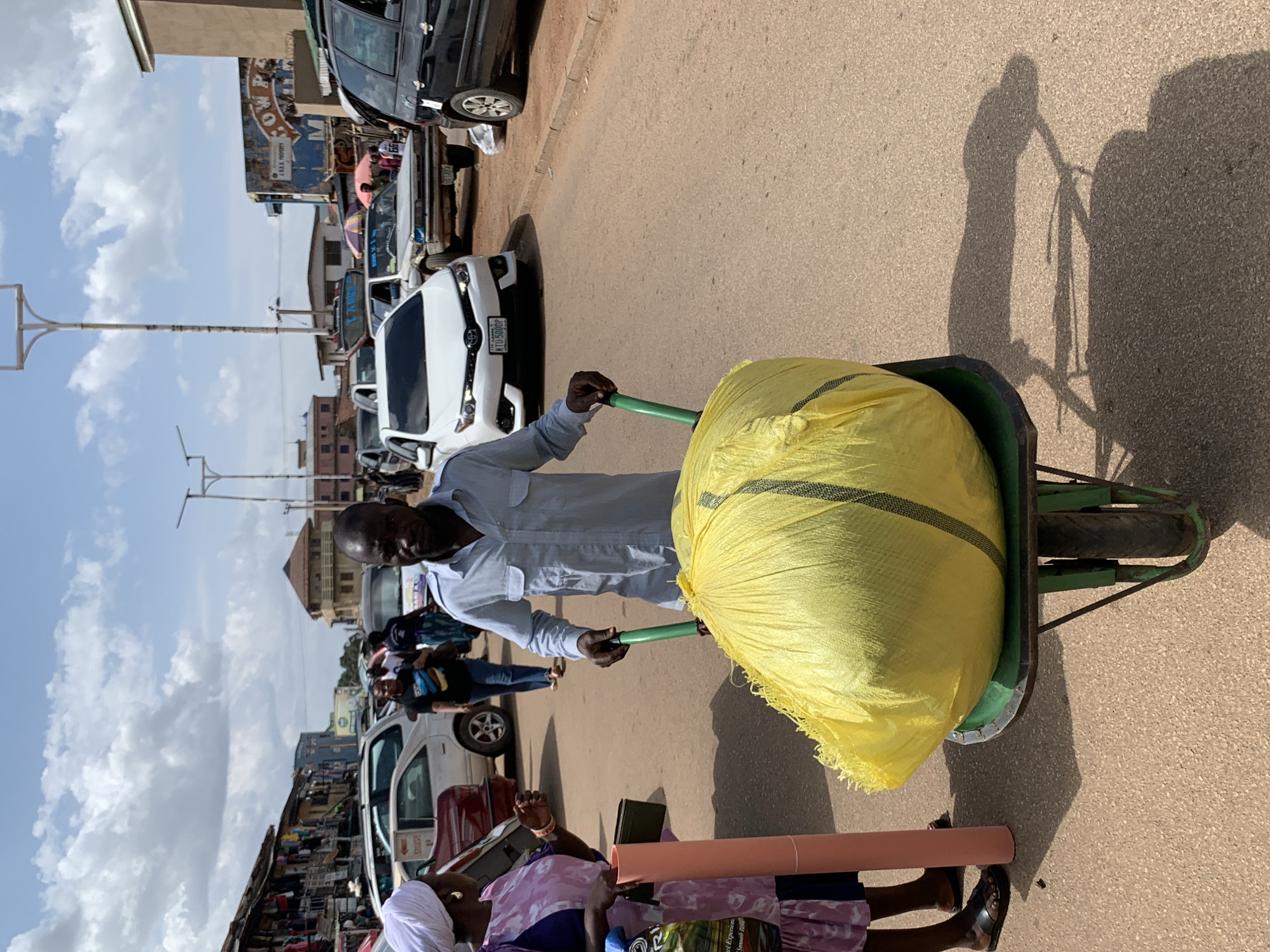 Midday street life and market movement in Jos, Nigeria