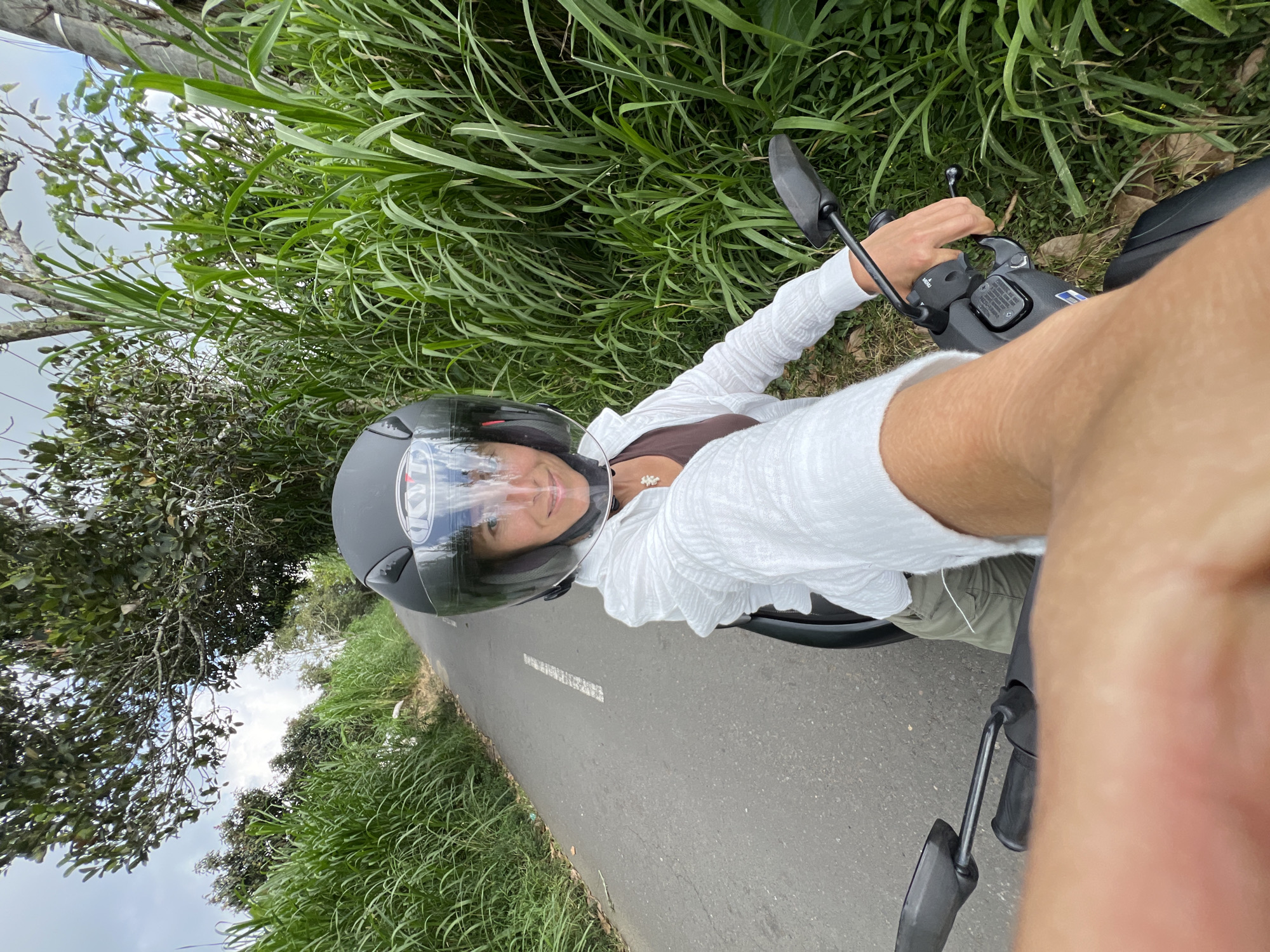 Woman on moped observed in Kintamani, Indonesia