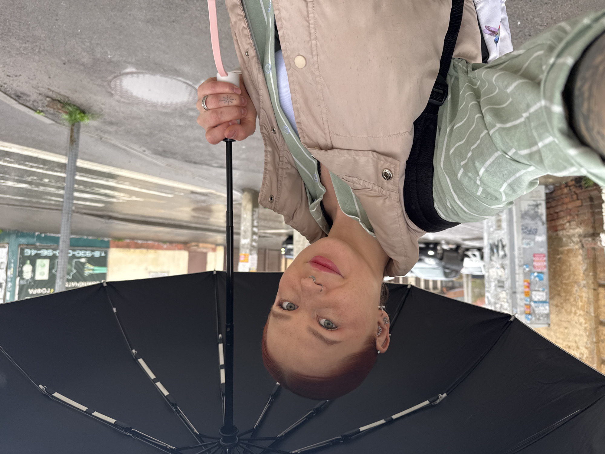 Woman with umbrella observed during rainy morning in Rostov-on-Don