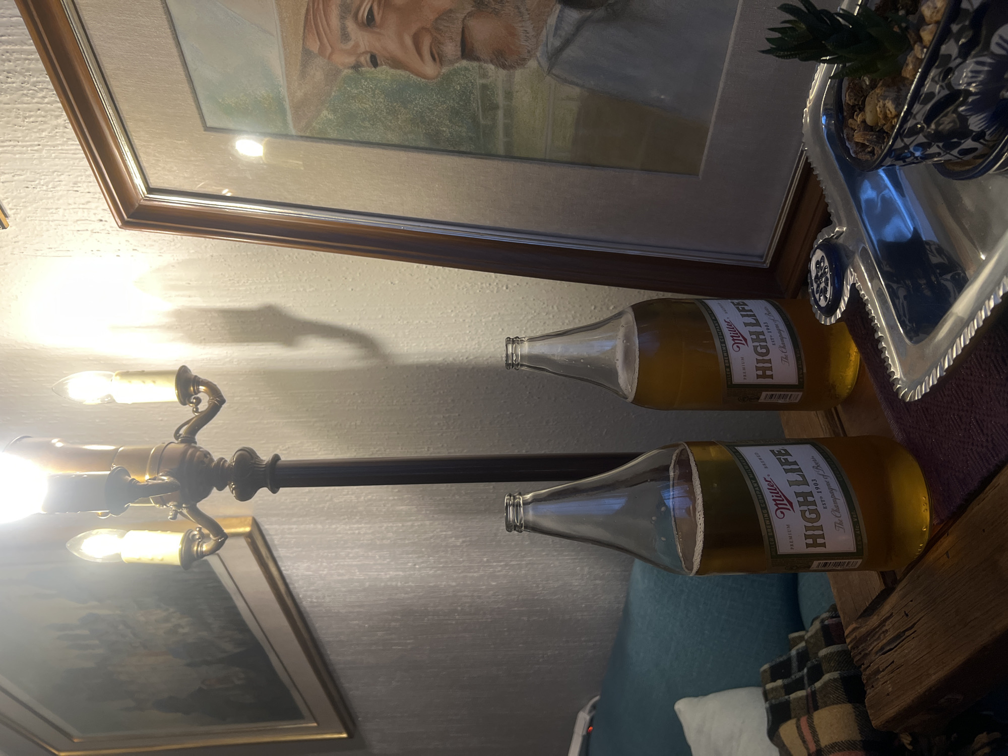Indoor scene captured with beer bottles and artwork in Mexico City