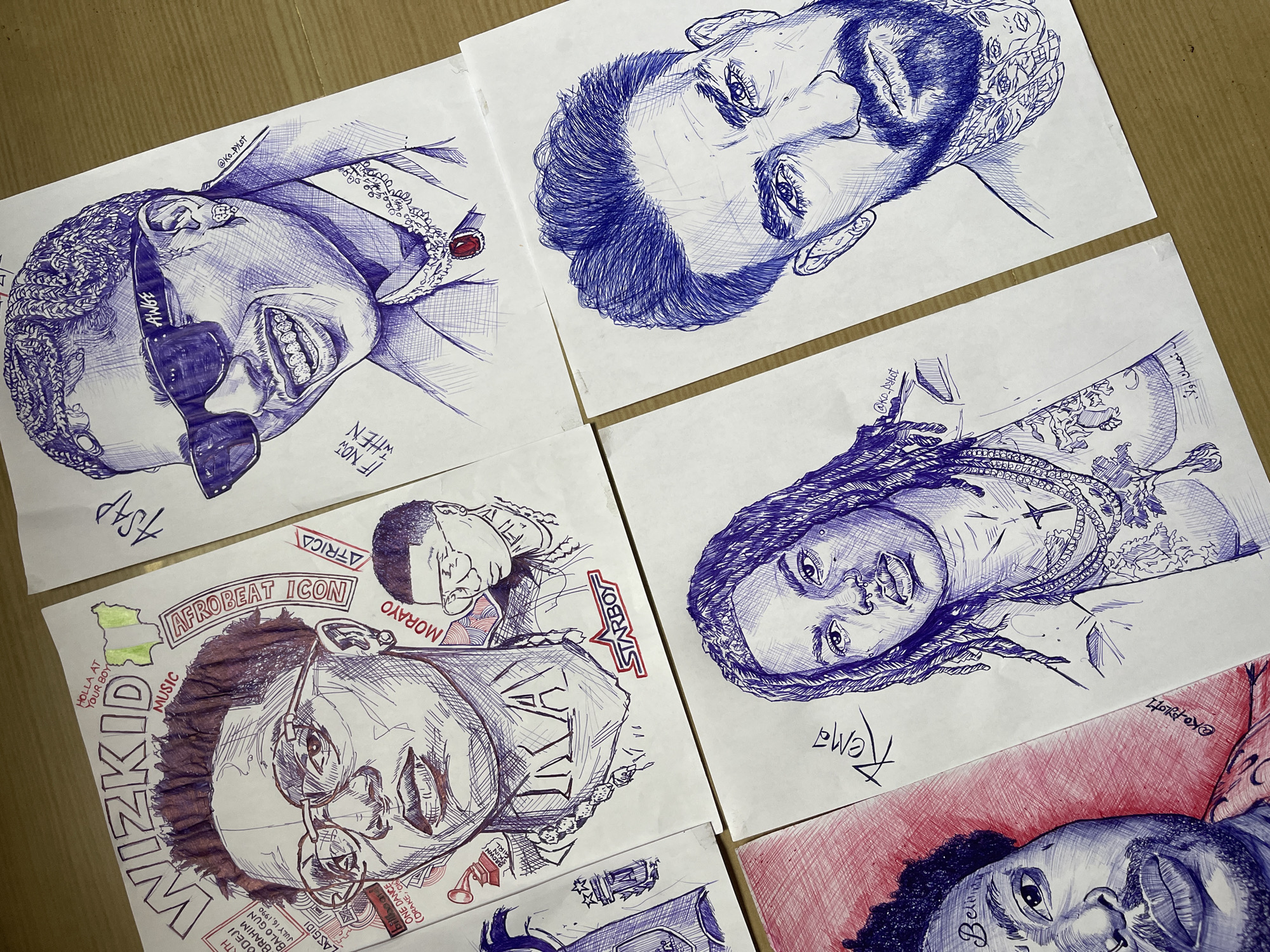 Ballpoint pen portrait collection laid out in Jos, Nigeria