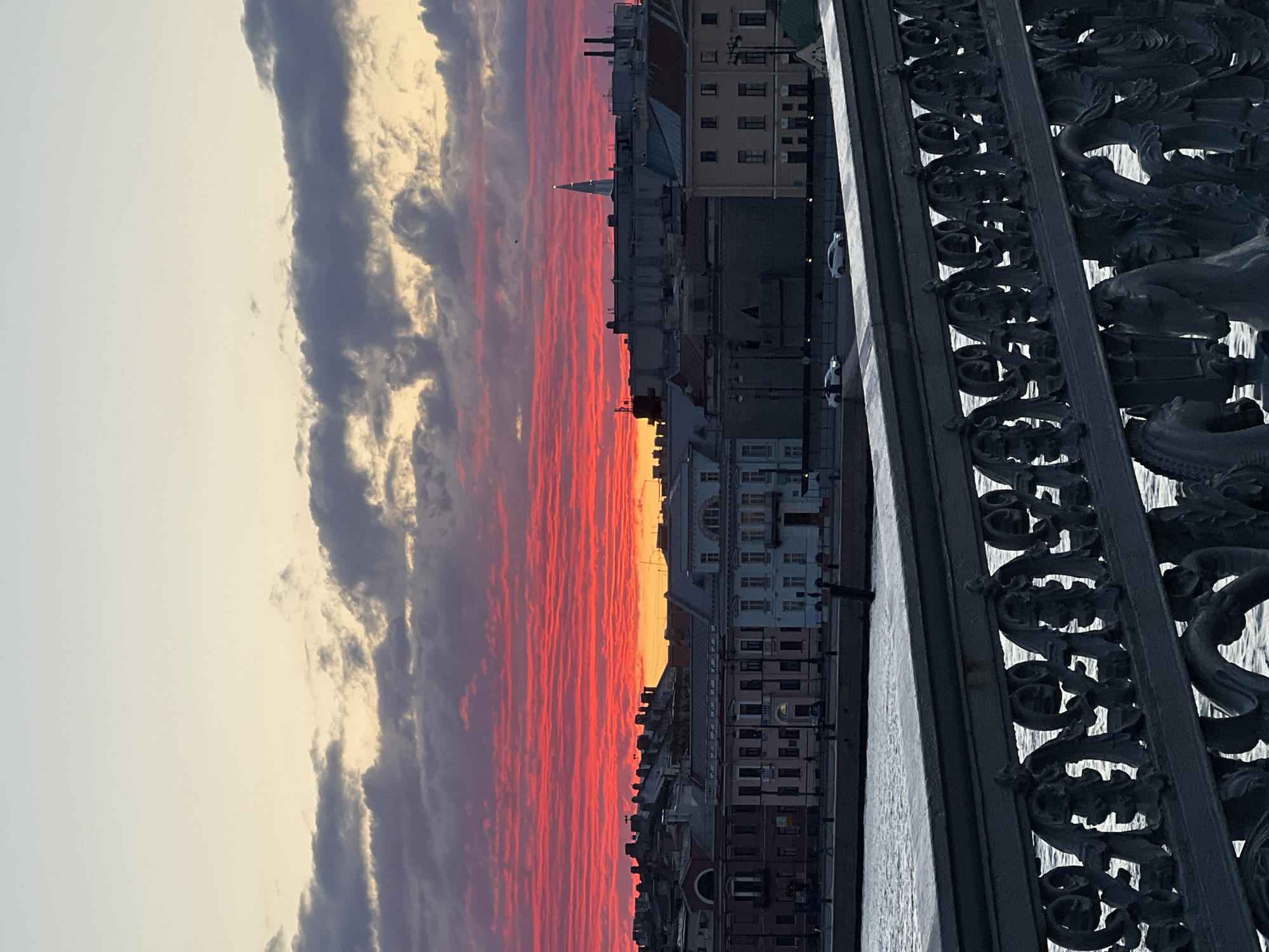 Sunset observed over Saint Petersburg waterfront with research vessels docked