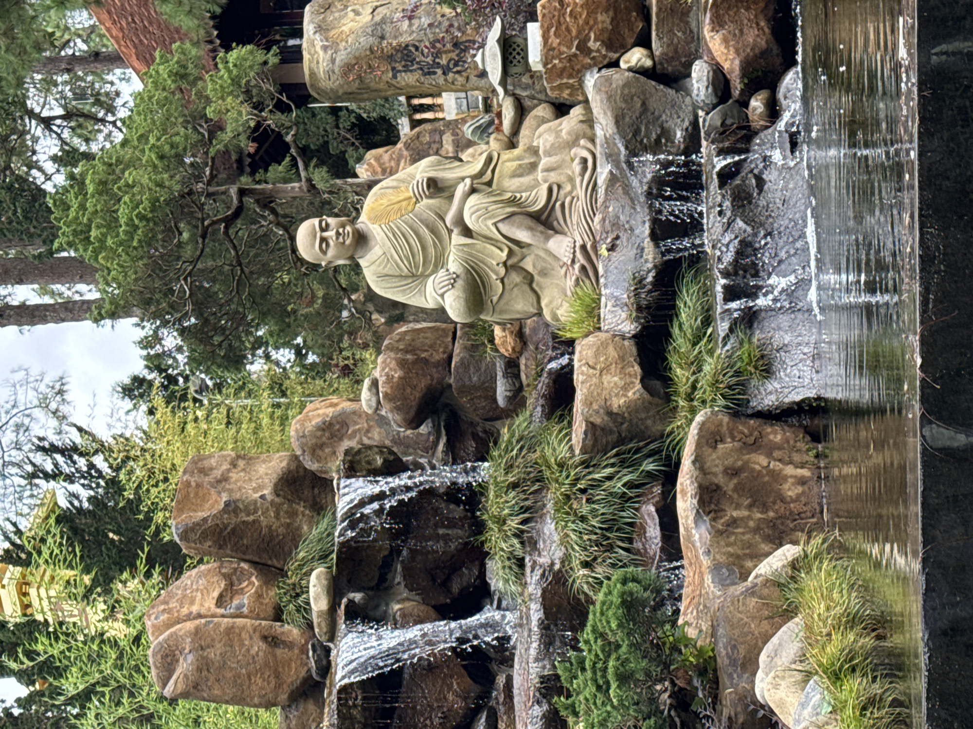 Visitors explore Buddhist monastery grounds in Da Lat, Vietnam