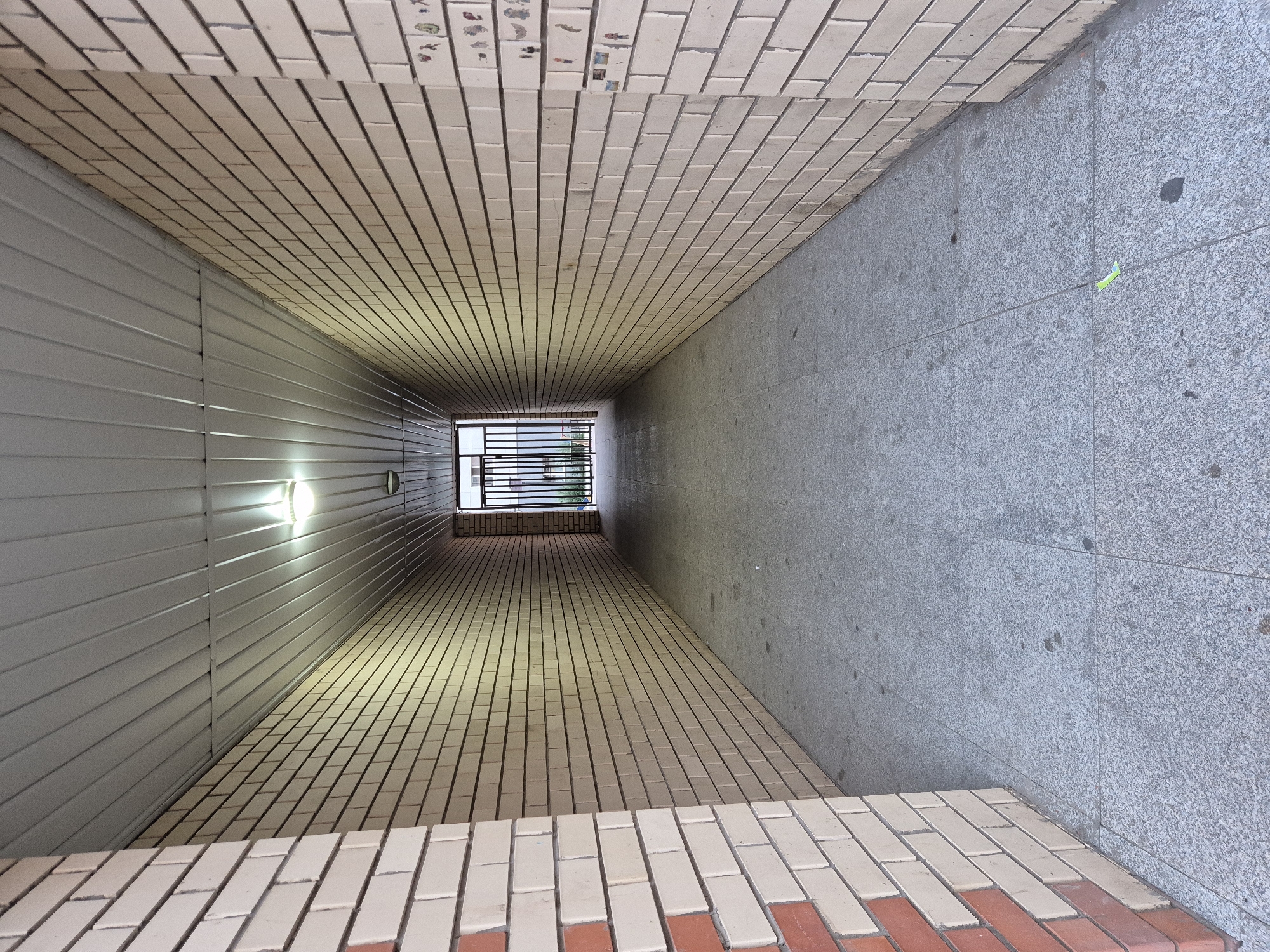 Brick apartments and covered walkways in an Astana neighborhood