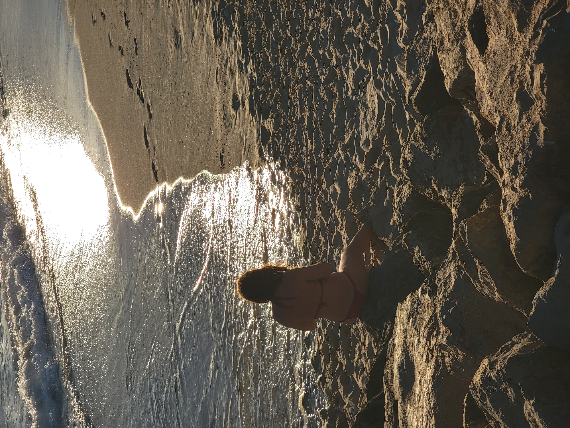 Sunset hour on the rocks at Quarteira beach
