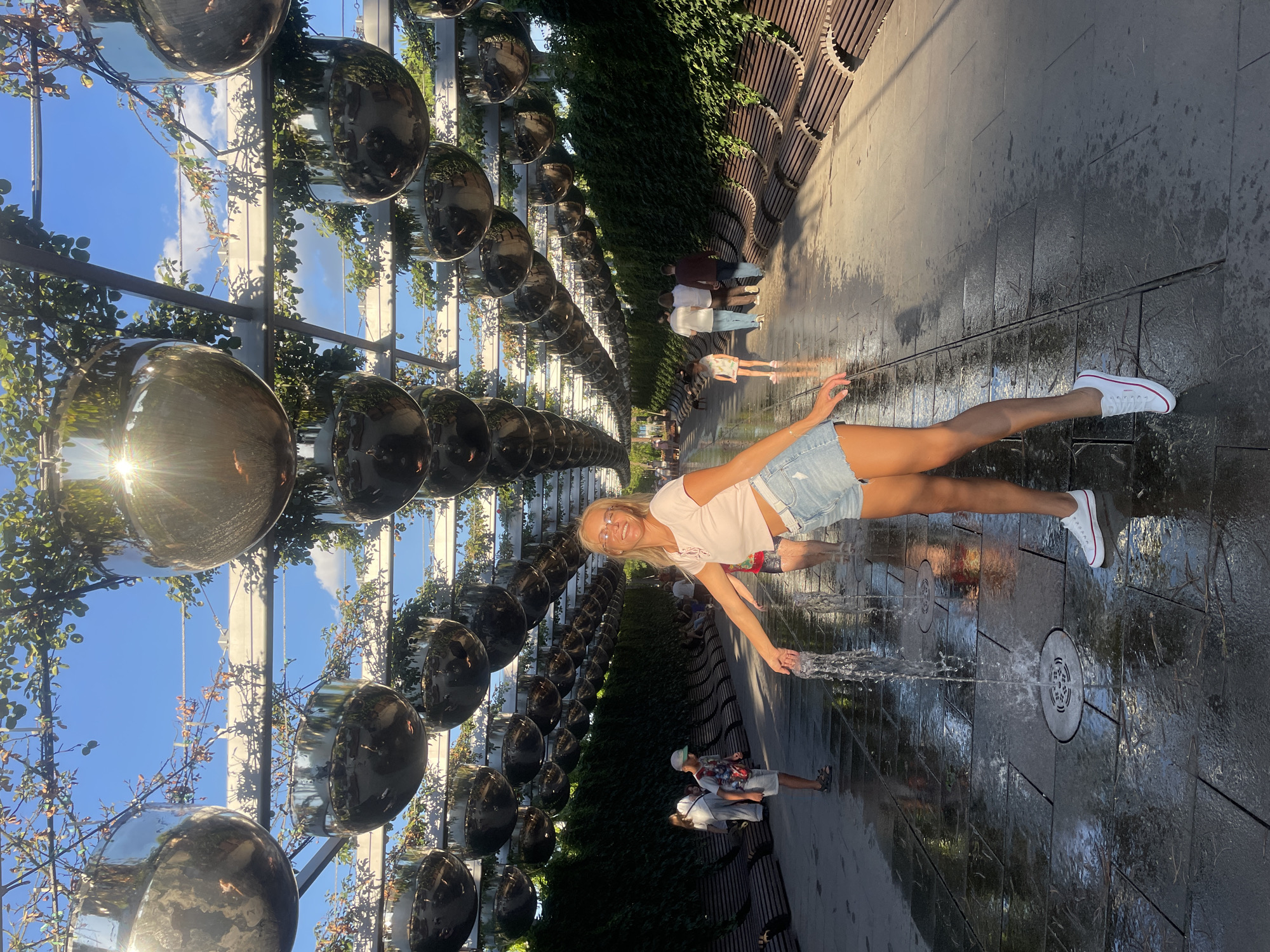 Sunny afternoon at Krasnodar park with fountains and public sculpture