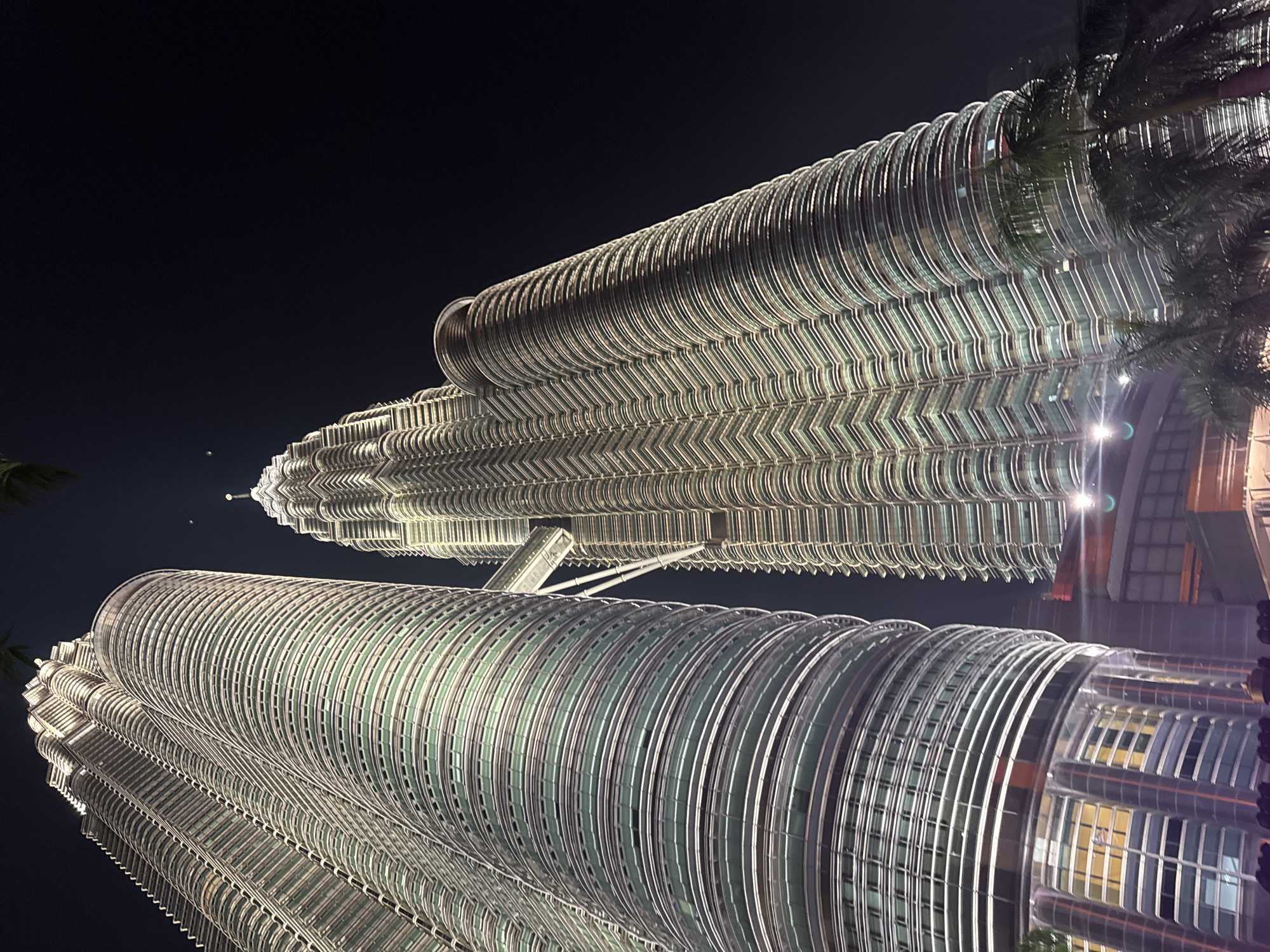 Tourists capture evening photos at Kuala Lumpur's Petronas Towers