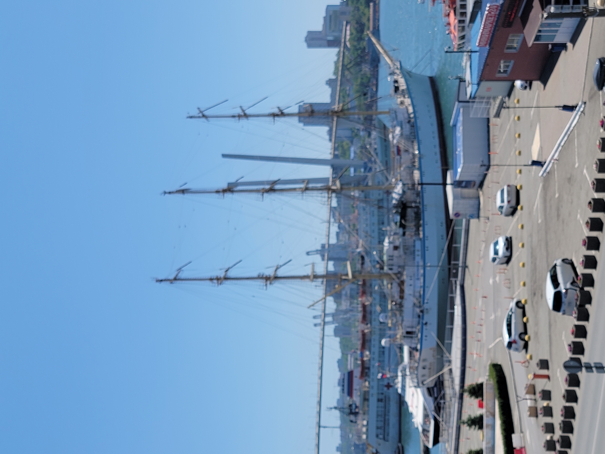Mixed transportation scenes documented at harbor and railway locations