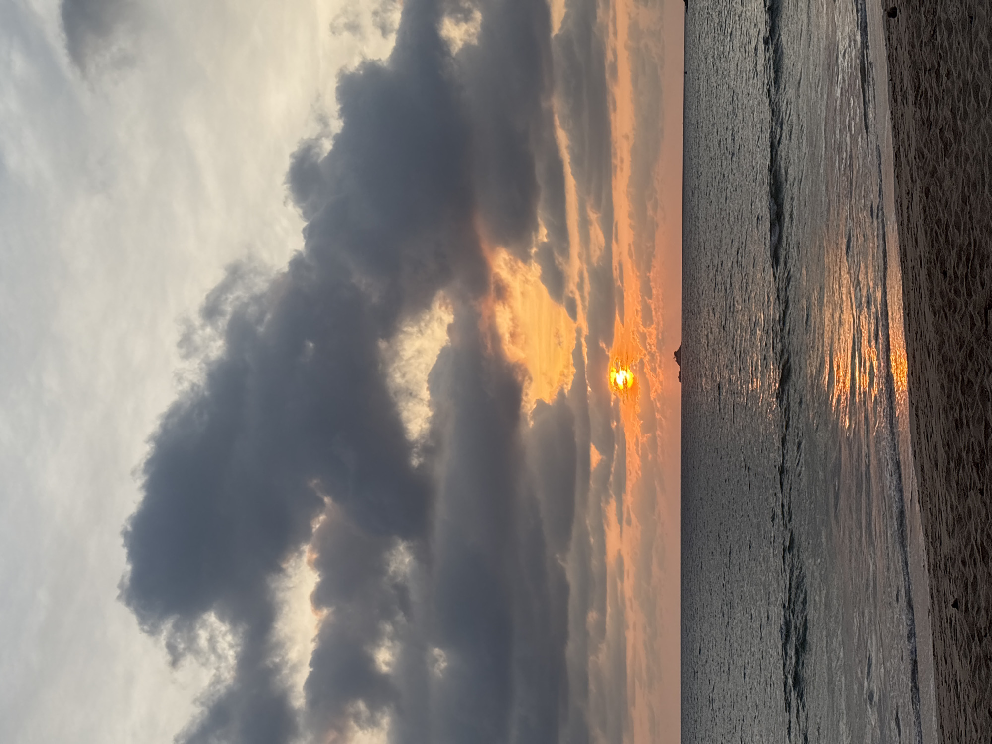 Beach burger dinner captured during Andaman Sea sunset