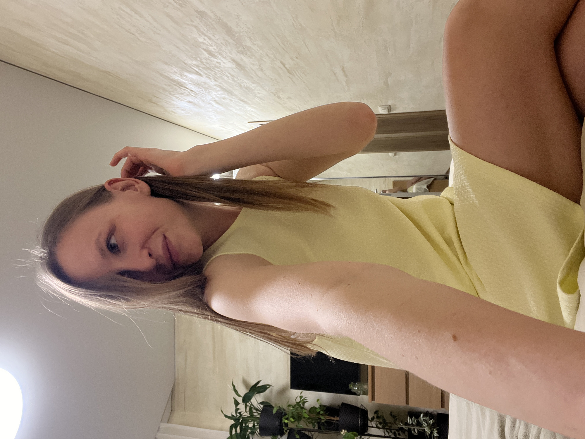 Woman takes selfies in yellow dress in Gelendzhik