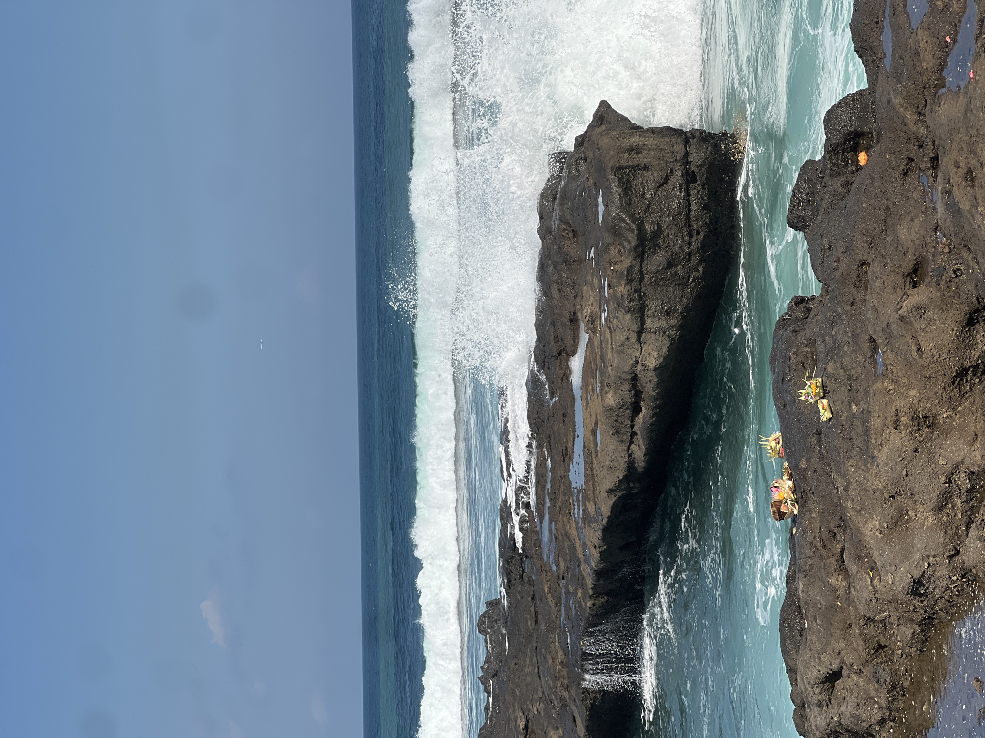 Surfers and beachgoers along Bali's North Kuta coastline