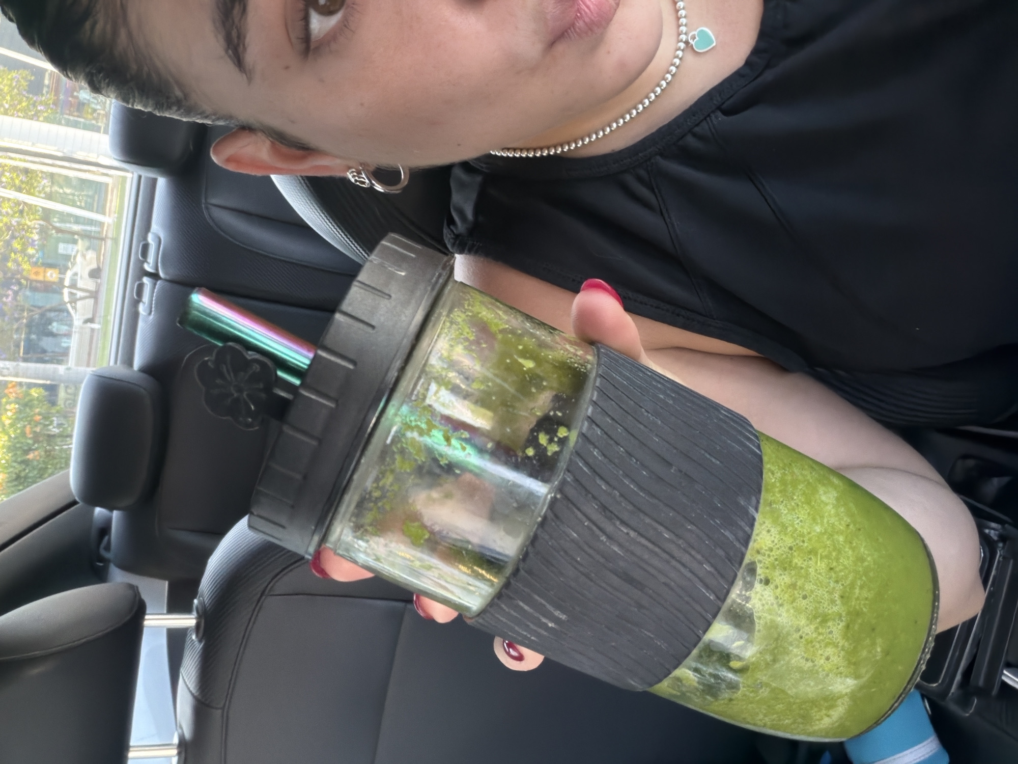 Person enjoys green smoothie in Puebla, Mexico