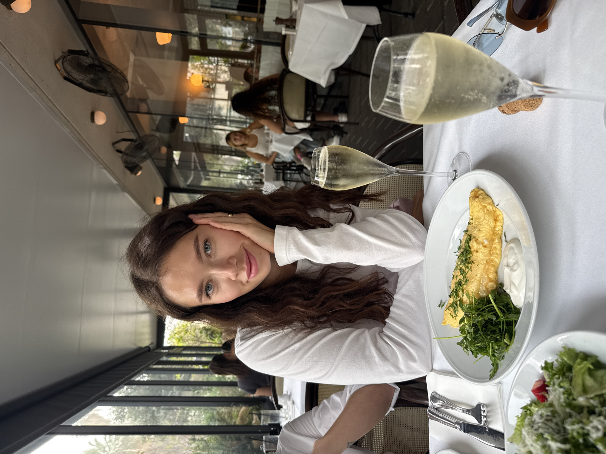 Woman enjoys champagne brunch at Tel-Aviv restaurant