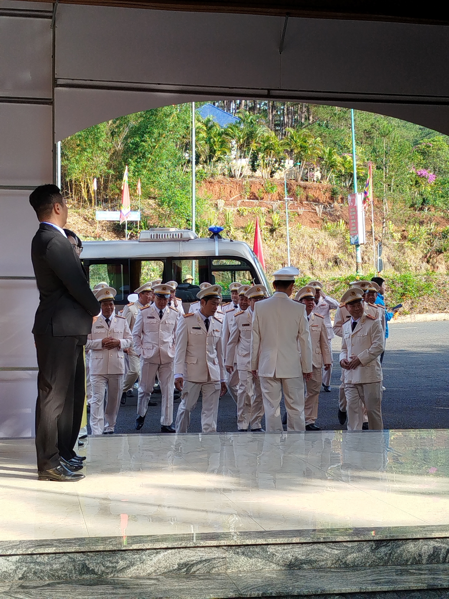 Uniformed group observed near golden statue in Da Lat