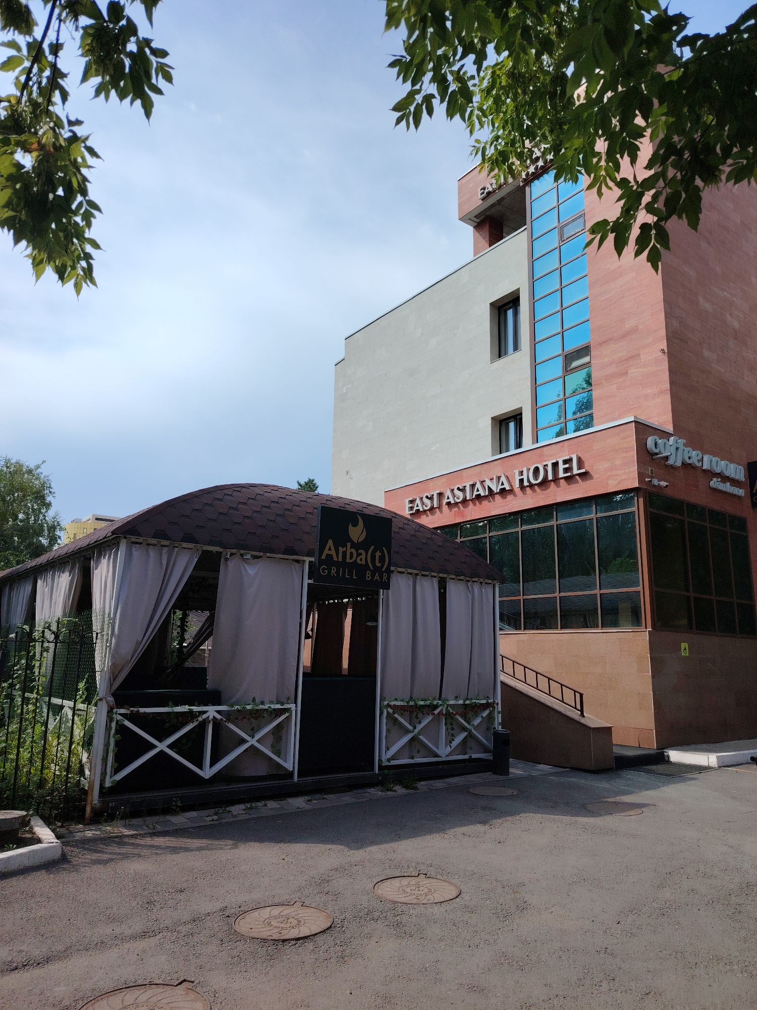 Street-level details from a quiet Astana neighborhood morning