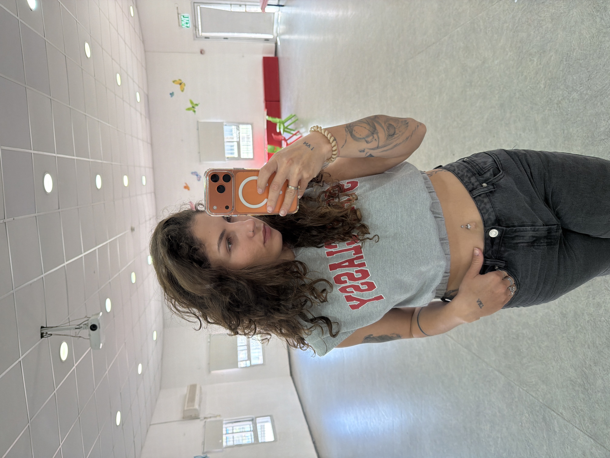Woman takes selfie in Kiryat Bialik dance studio