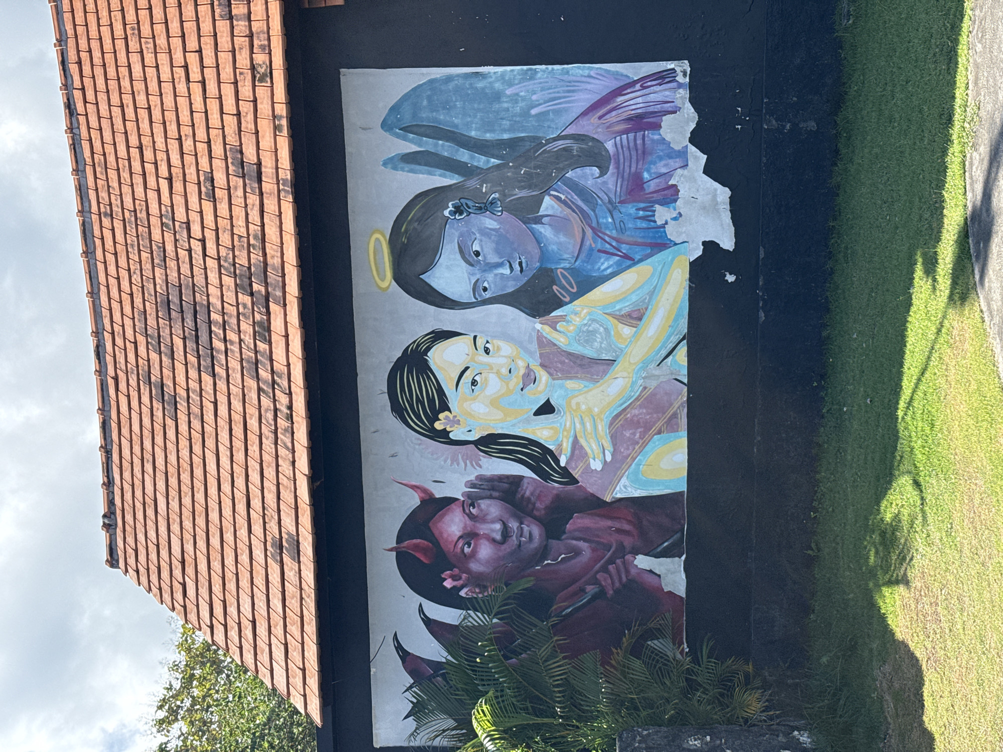Angel, woman, devil mural spotted on Nusa Penida building