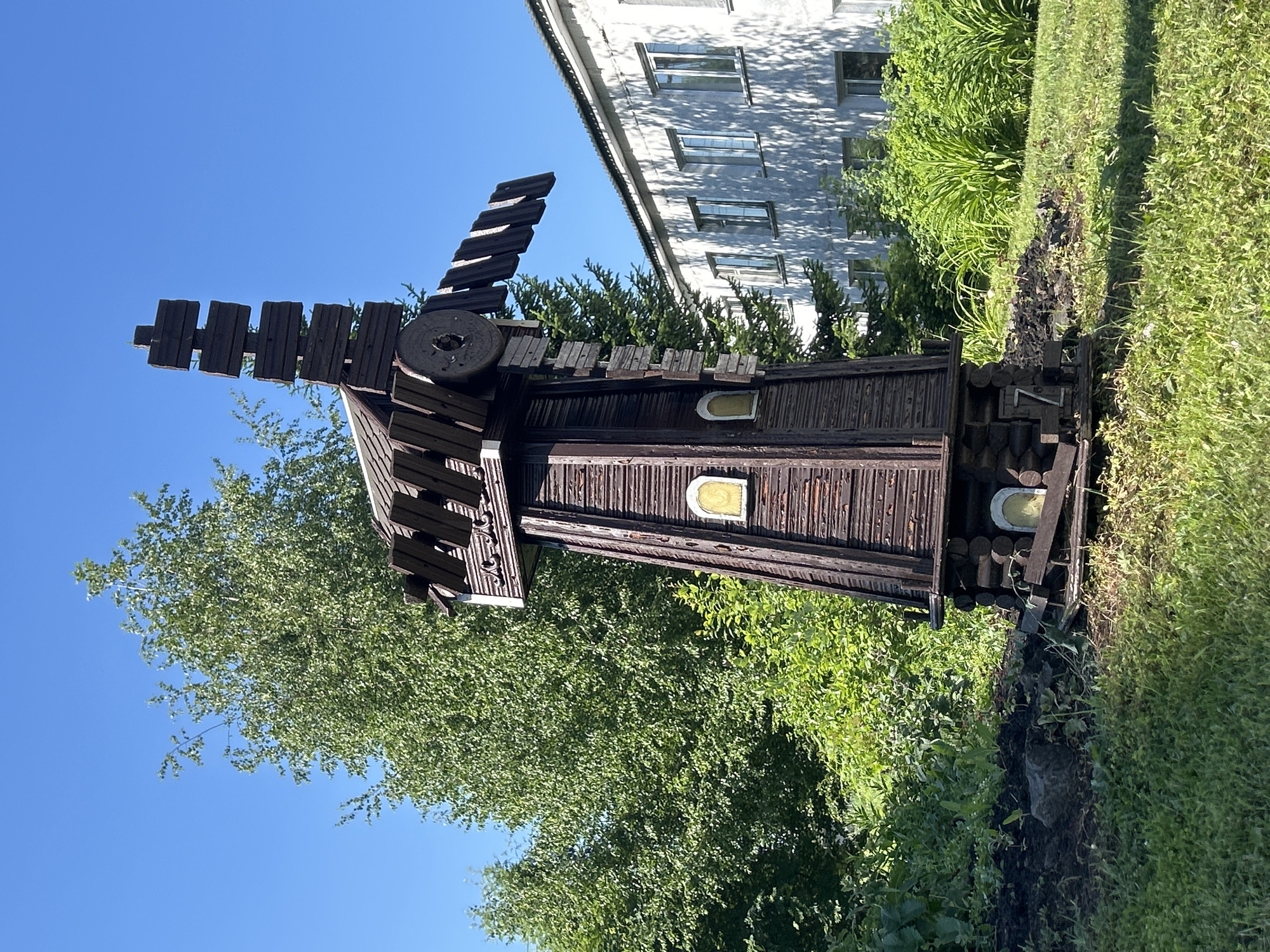 Decorative windmill and garden bench in Zelenogorsky, Russia