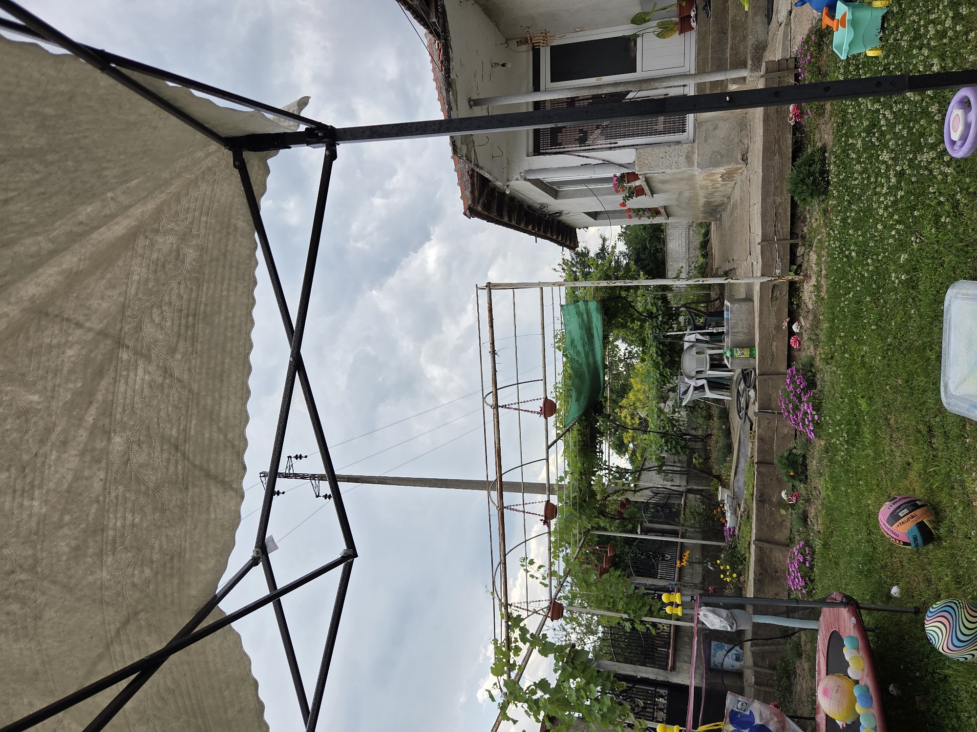 White canopy set up in a backyard in rural Bulgaria