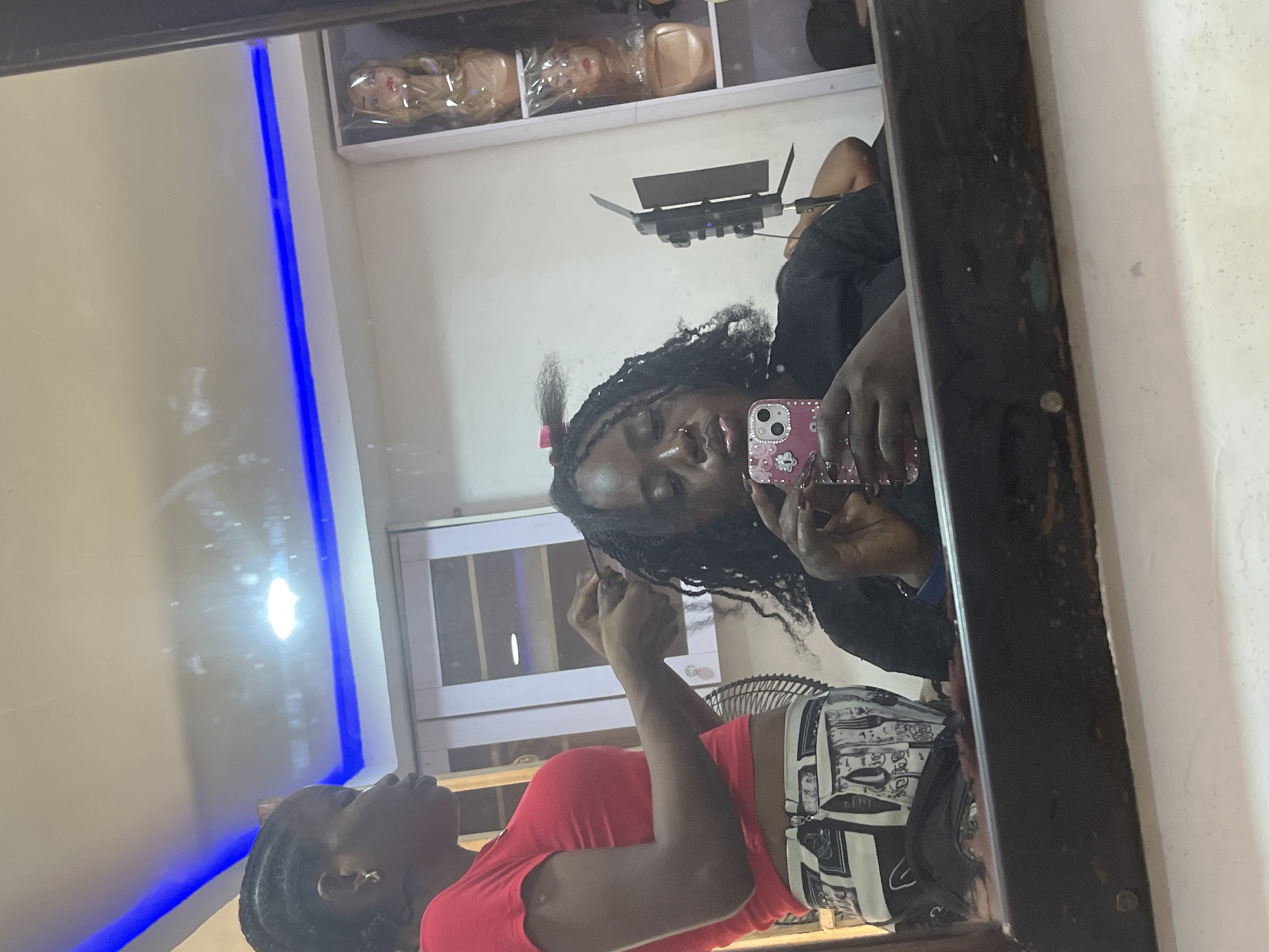 Abuja hair salon in full swing — braids, wigs, and selfies