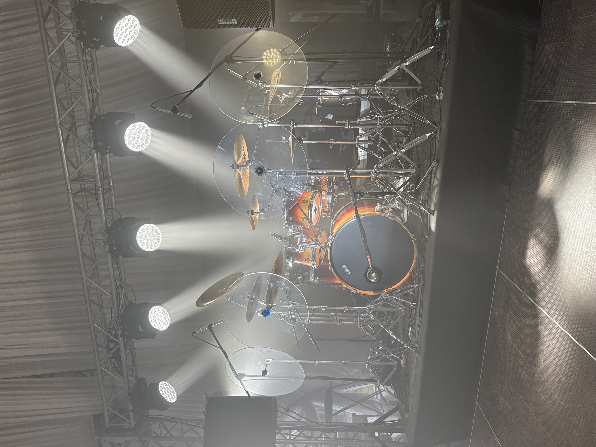 Drummer with sticks observed over drum set in Shchekutino