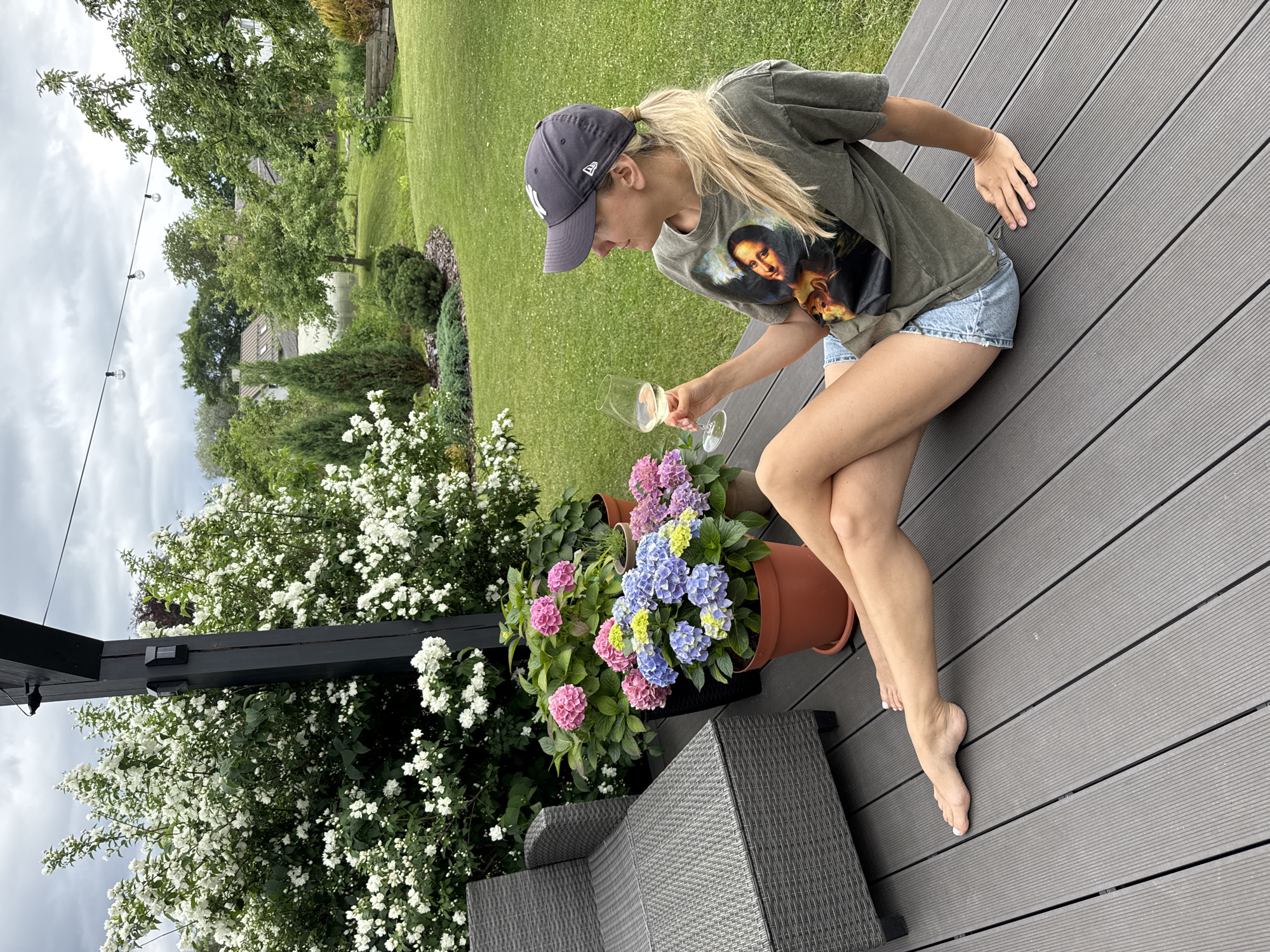 Backyard afternoon: wine and dogs inside, yard work outside