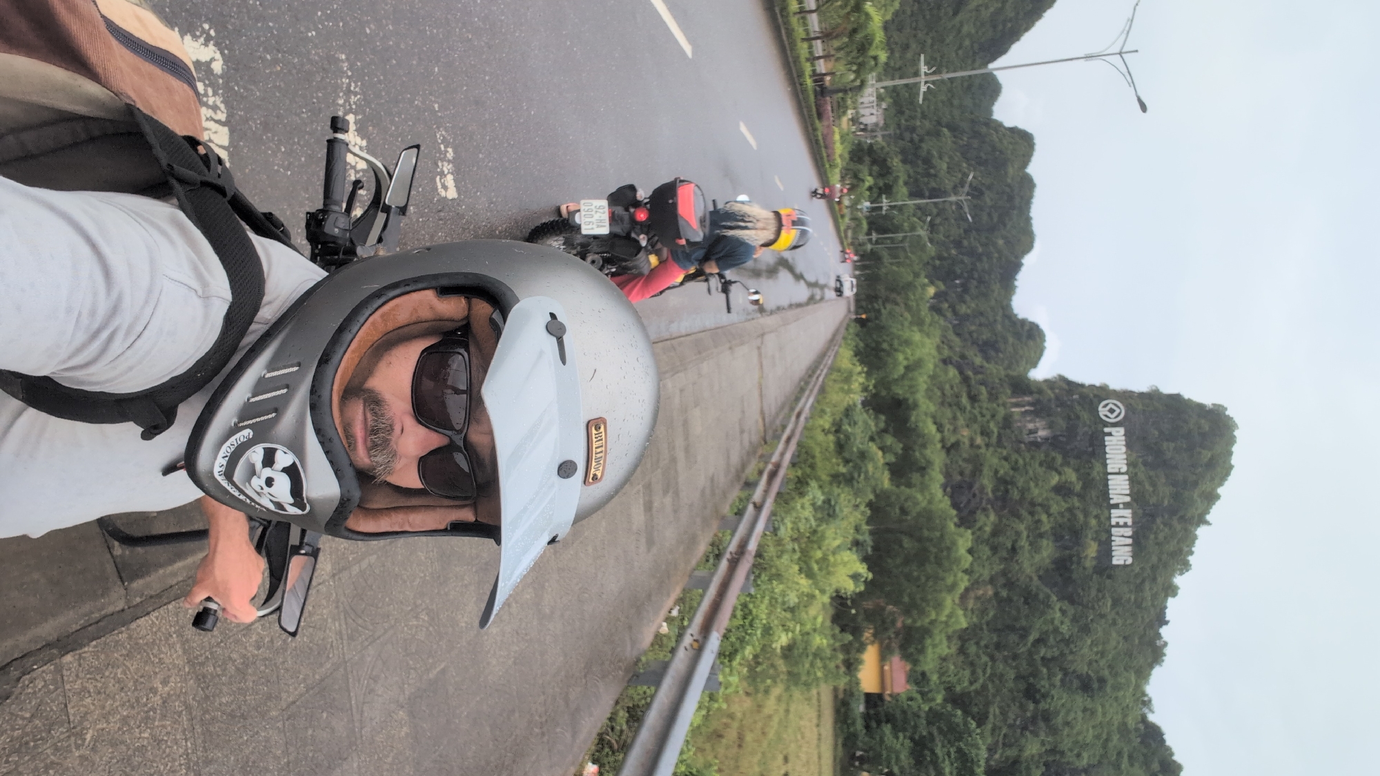 Motorcycle touring through wet roads in Phong Nha, Vietnam