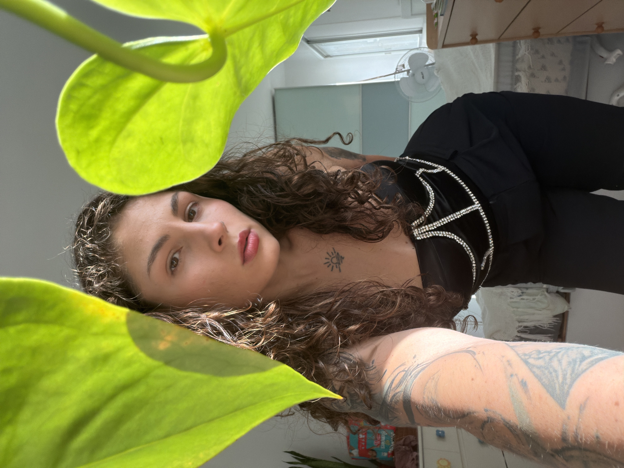 Woman takes selfies with foliage in Kiryat Bialik